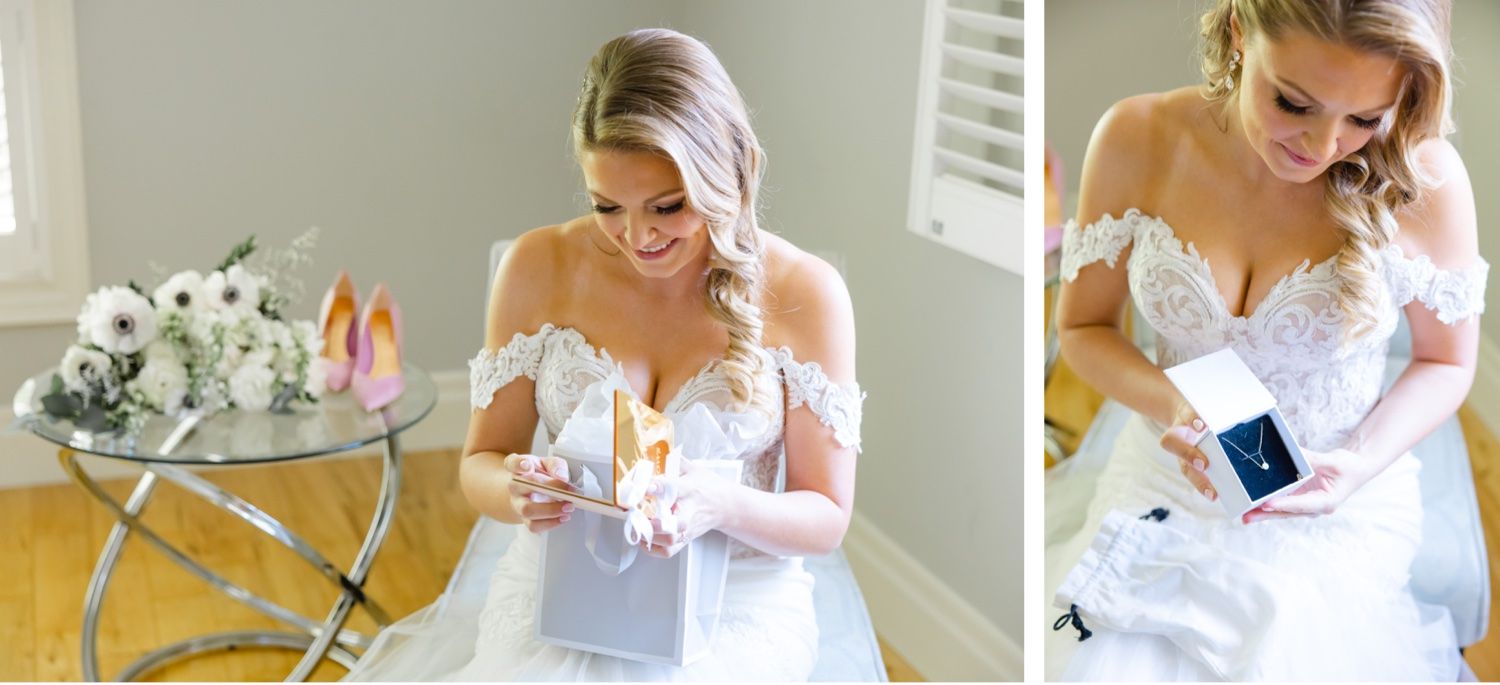 A bride in a white gown sits elegantly by a glass table with floral arrangements.