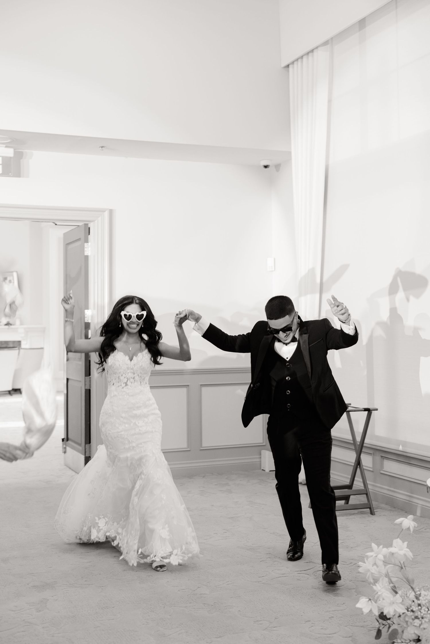 Joyful wedding celebration moment captured in black and white photography.