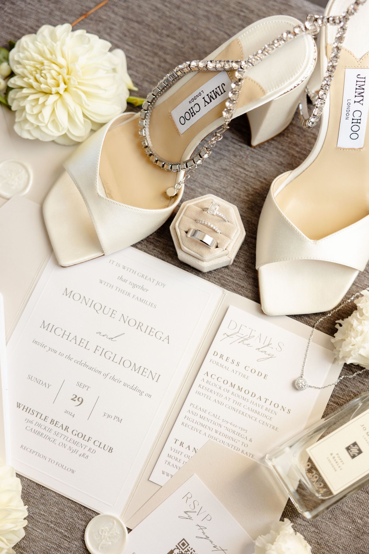 Elegant wedding flatlay featuring crystal-strap sandals and minimalist invitation suite.
