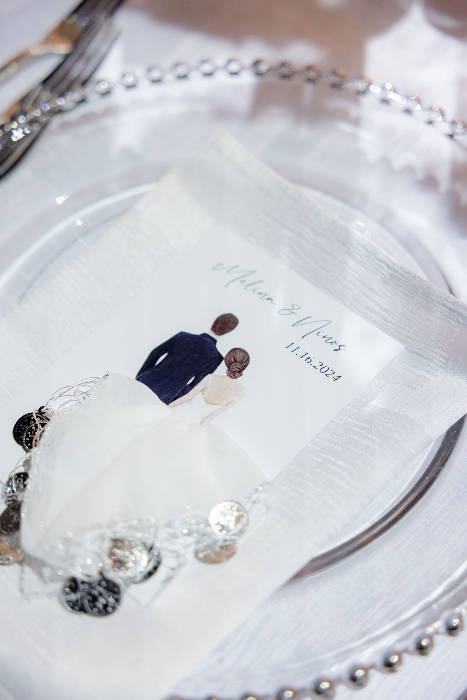 Custom charger plate featuring minimalist bride and groom illustration with beaded border.