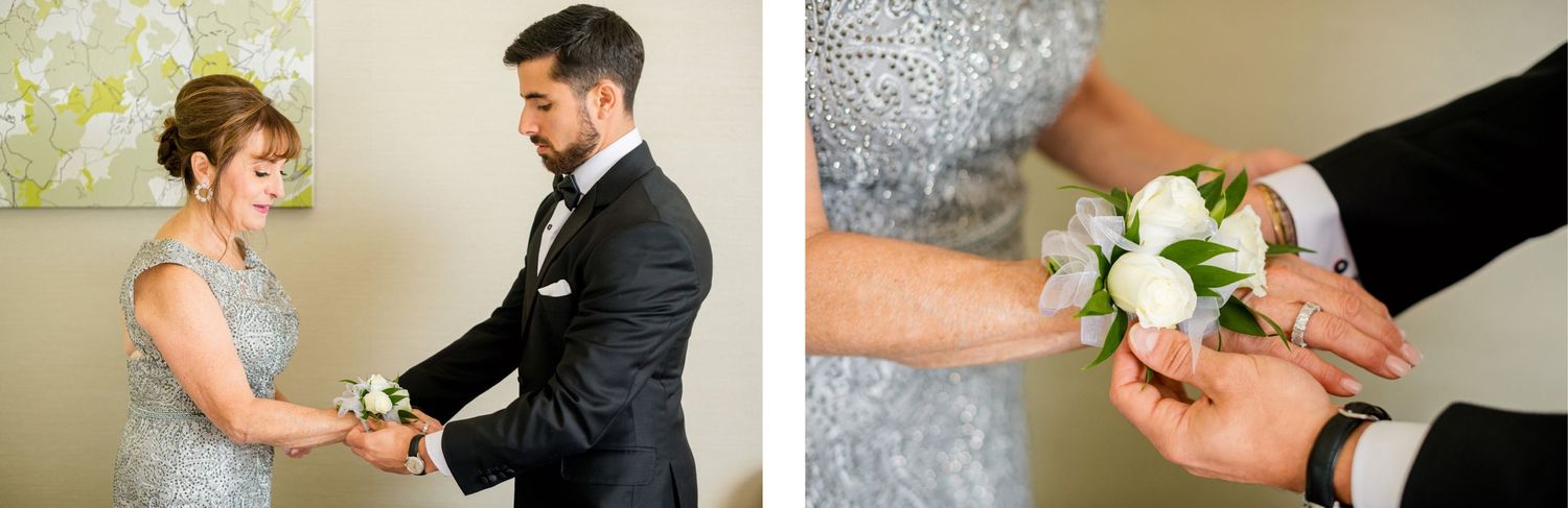Wedding preparations scene with white rose boutonniere being attached to formal attire.