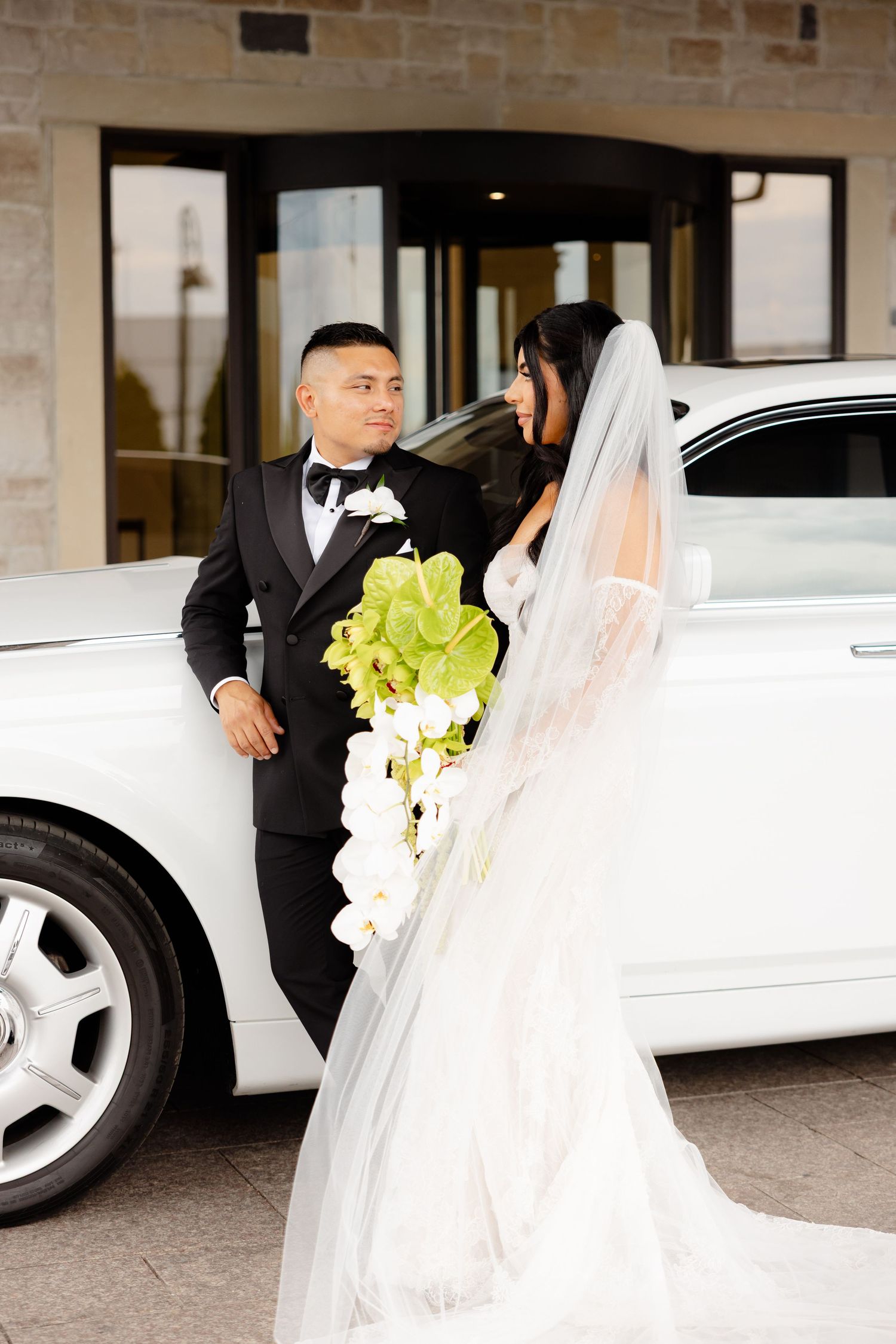 Three sequential photos showing a bride in a white dress and veil next to a white limousine during a wedding arrival.