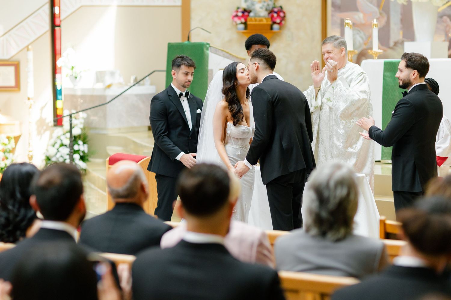 A traditional church wedding ceremony with attendants and guests gathered for the sacred occasion.