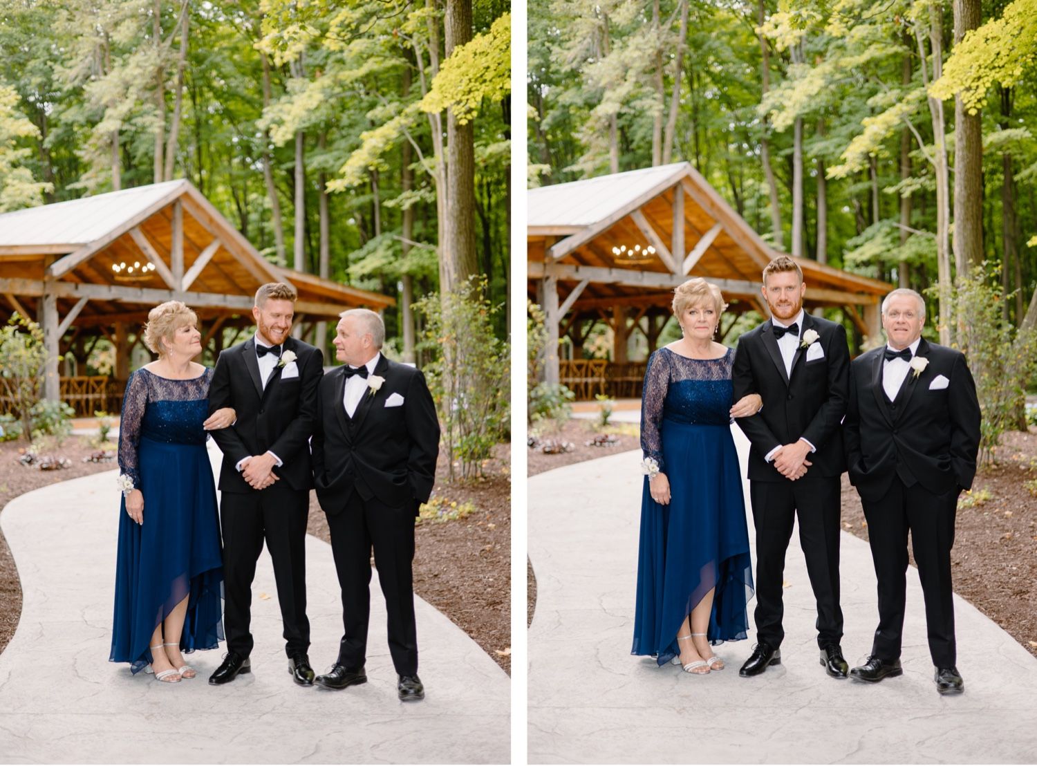 Wedding party in formal attire posing together outside rustic wooden pavilion.