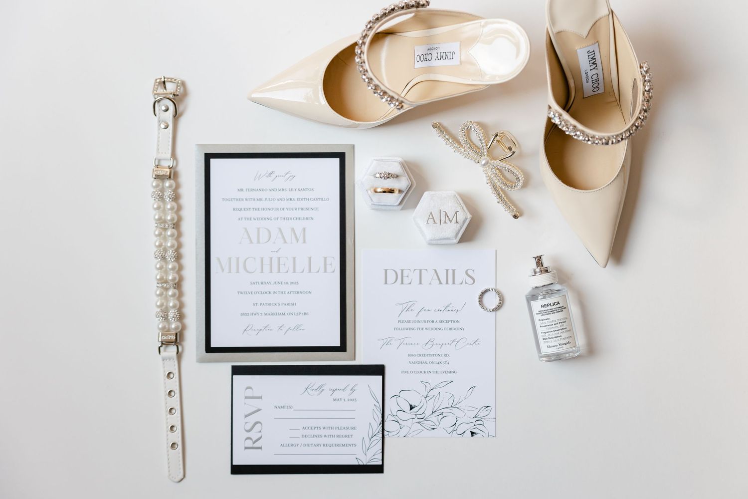 Elegant wedding details flat lay with invitation suite, beige shoes, and bridal accessories.