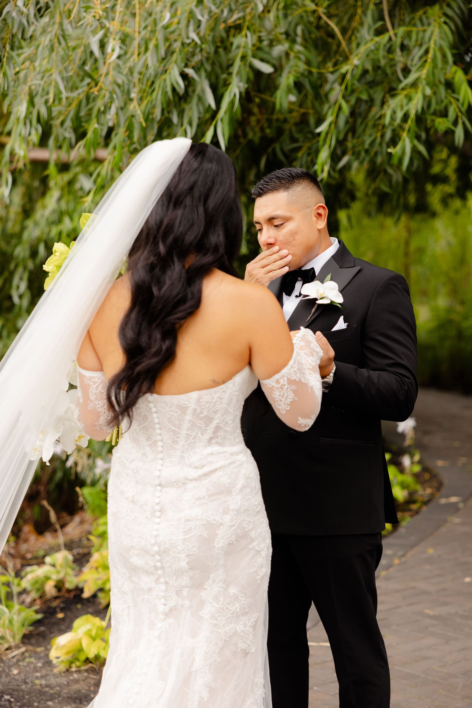 A series of wedding photos showing a couple dancing together outdoors with willow trees in the background.