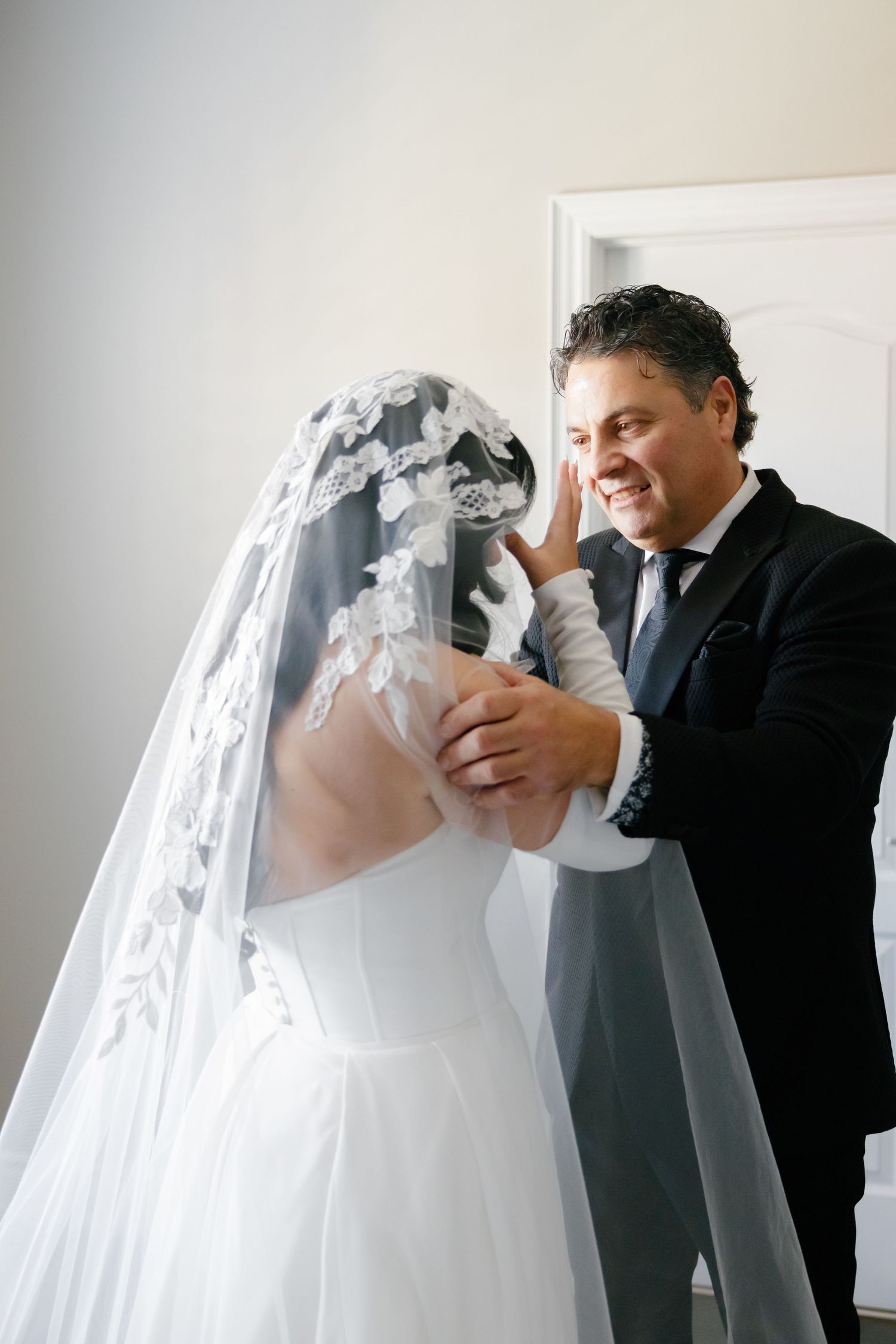 A tender moment between newlyweds during their first look before the ceremony.