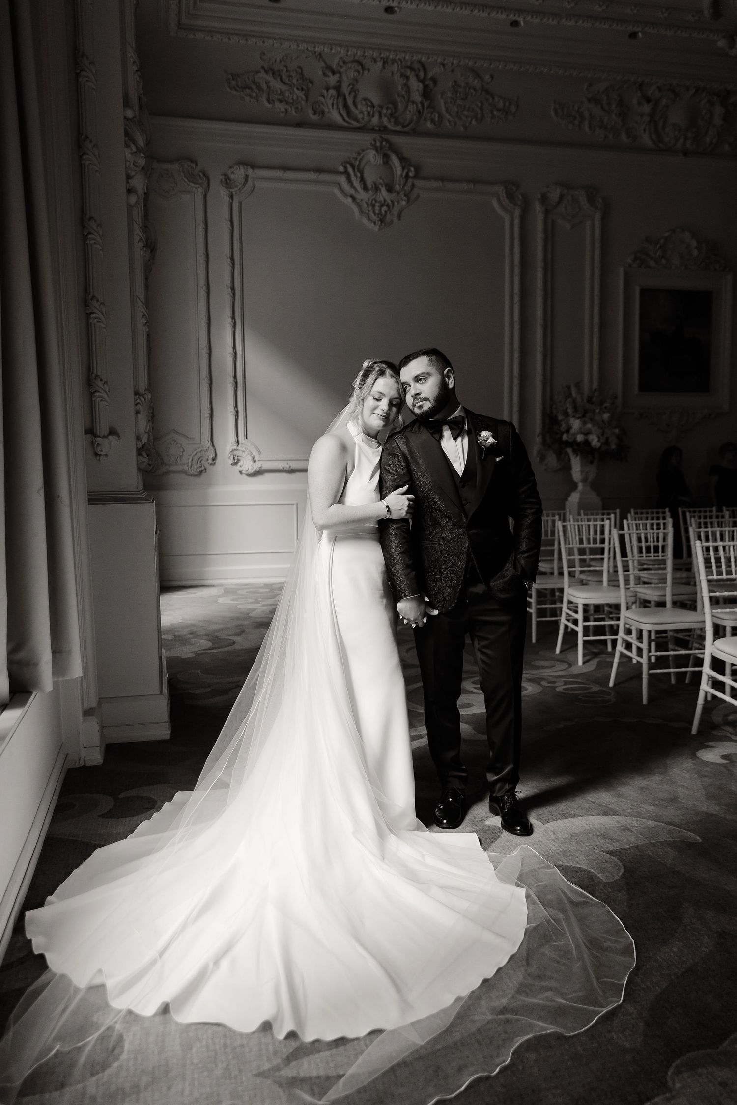 Artistic sequence of wedding portraits showing a couple in front of ornate white walls and chiavari chairs.