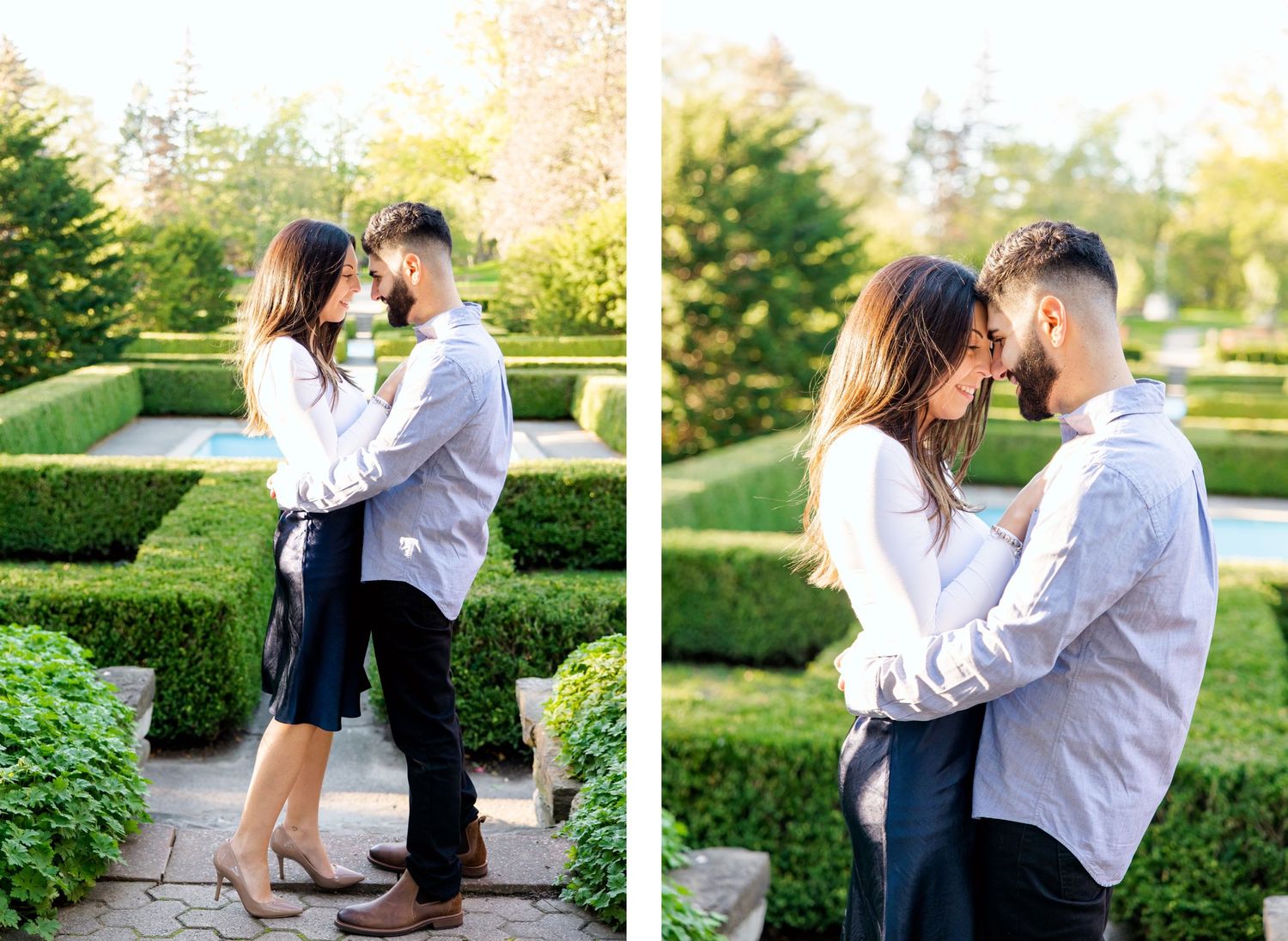 A couple embracing in a manicured garden with geometric hedge designs.