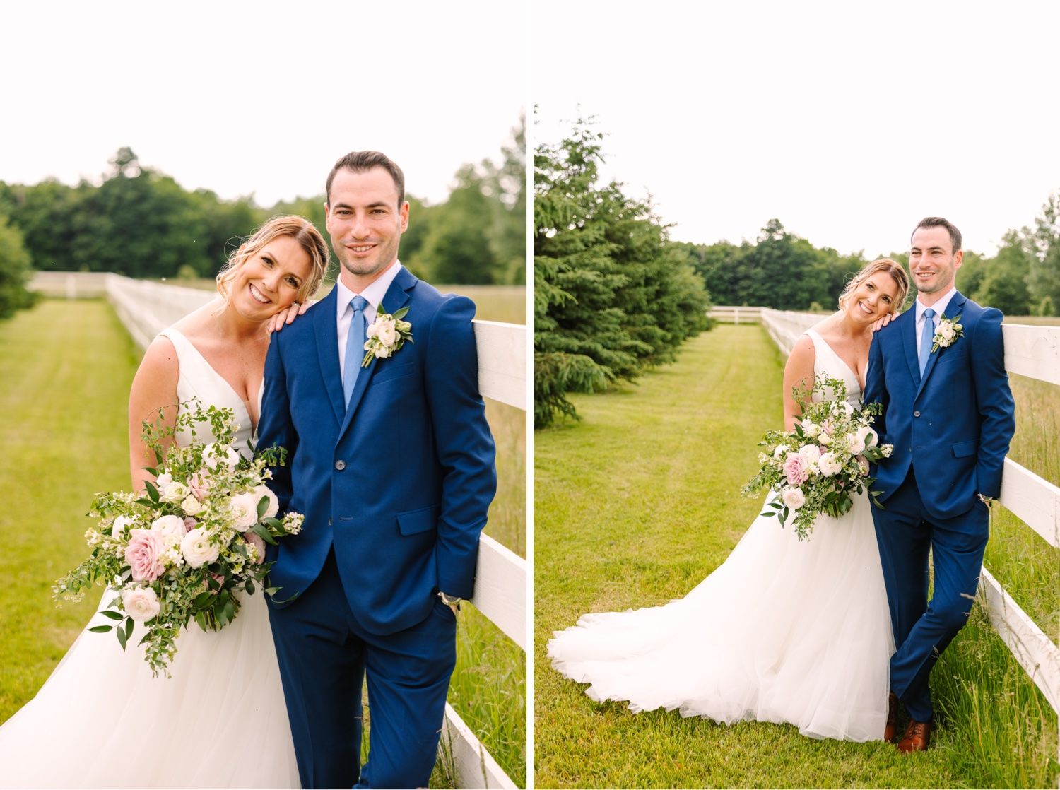 Wedding couple poses by white fence on sunny day with lush bouquet and navy suit.