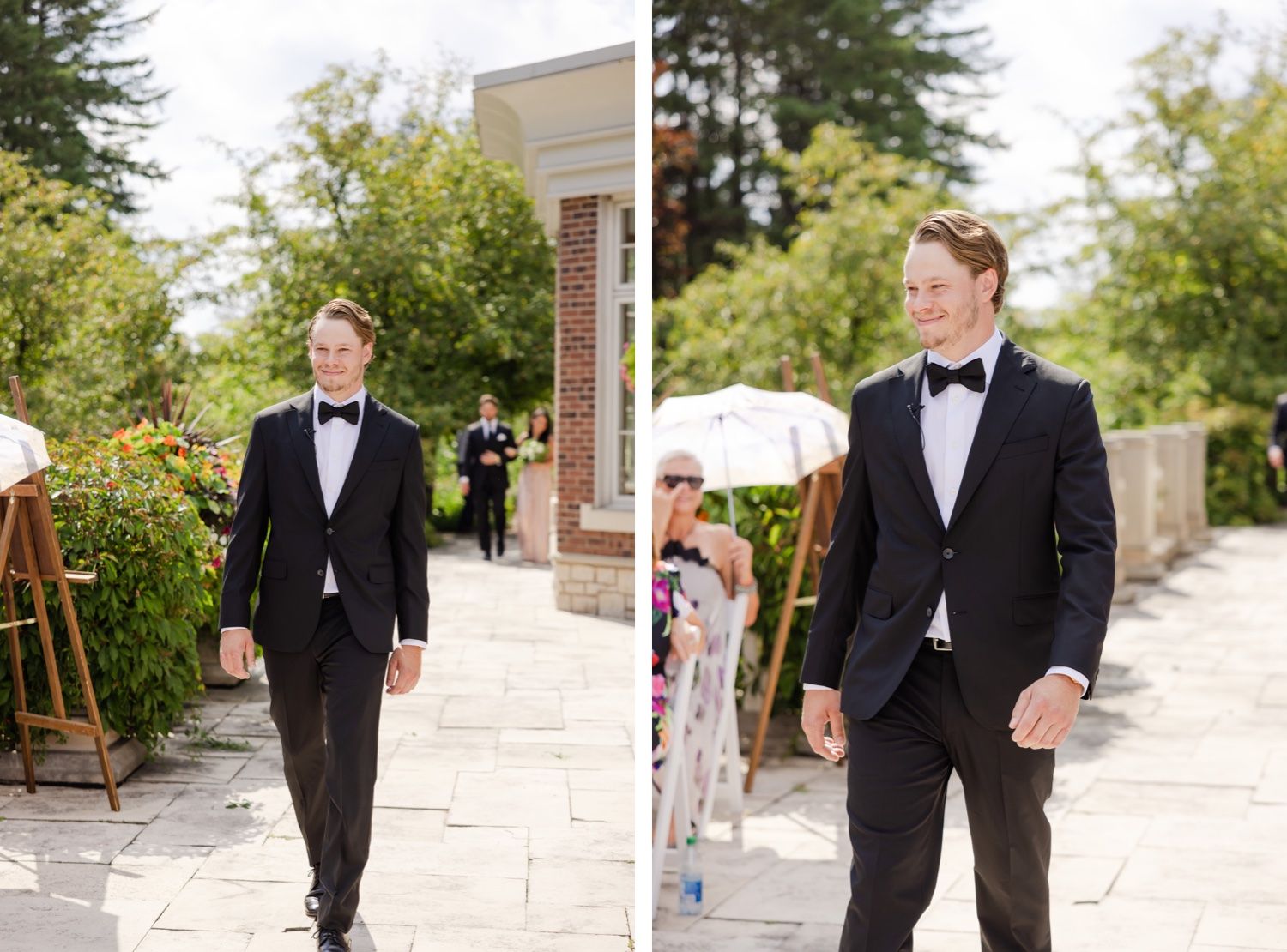 Groom in classic black tuxedo walking along stone pathway on wedding day.