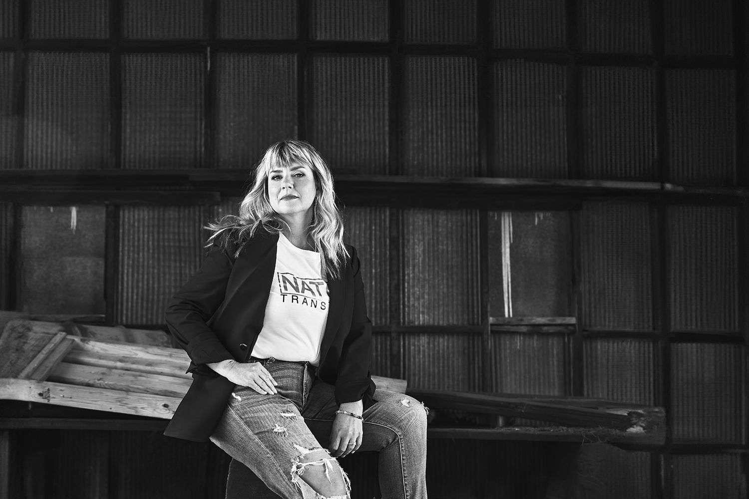 Black and white photo sequence in an industrial setting with dramatic lighting.