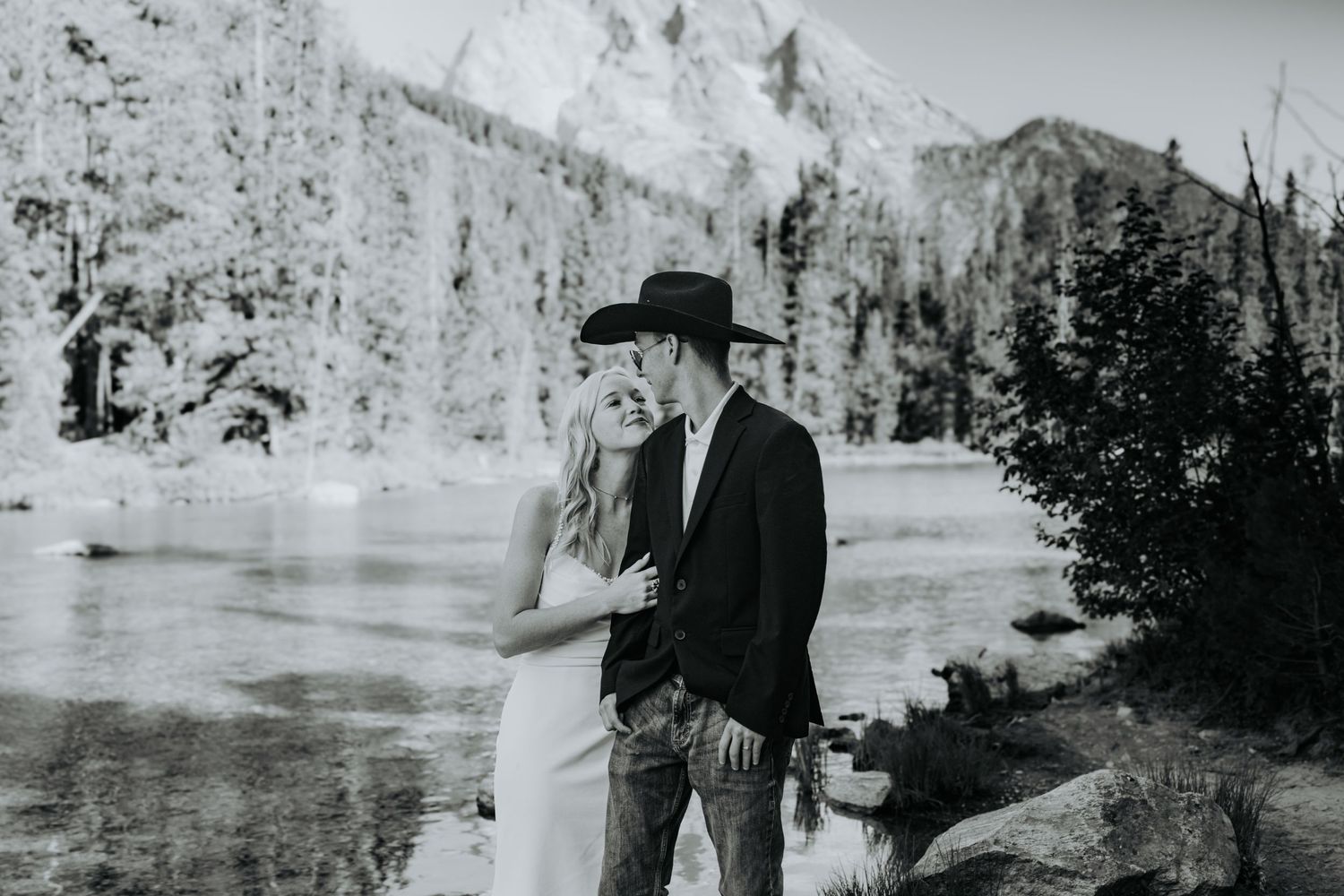 A black and white photo strip showing people posing outdoors on a snowy winter landscape against a mountainous backdrop.