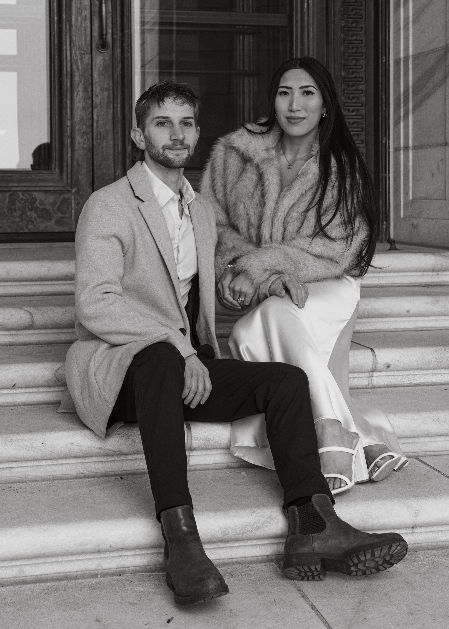 Black and white collage of four images showing a couple sitting on outdoor steps in casual attire.