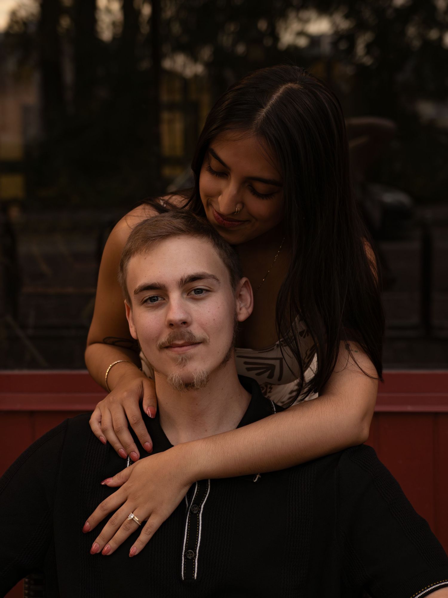 A couple embraces and shares tender moments in a series of casual outdoor photos.
