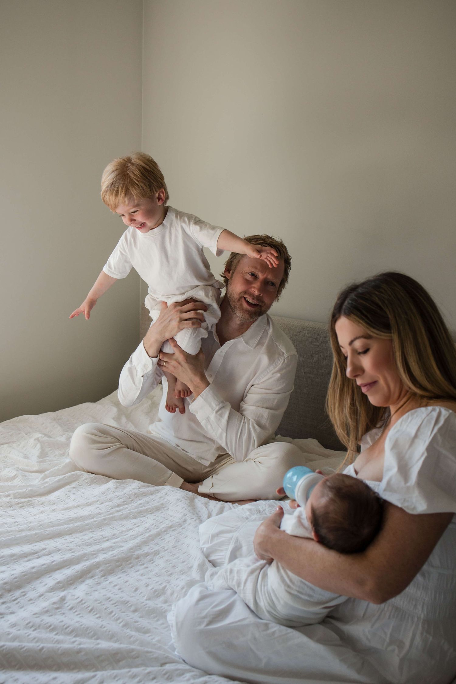 Real family life captured during a Toronto lifestyle newborn photography session at home.