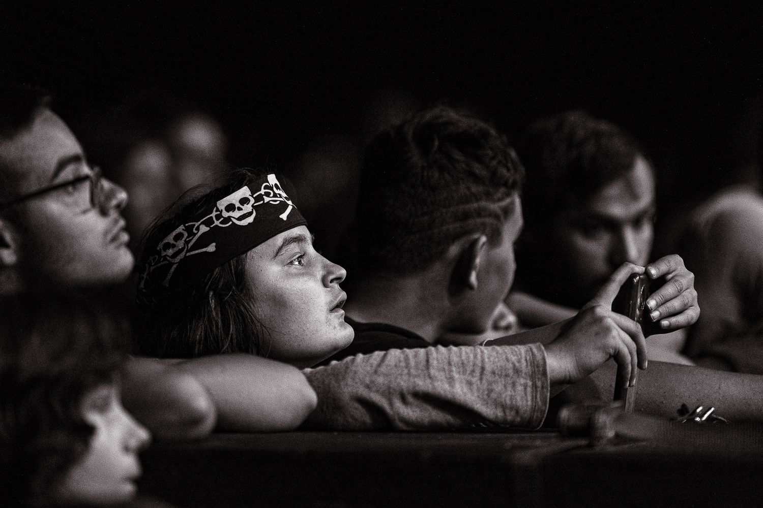 Black and white crowd close-up capturing emotion and immersion during the live performance in Bulgaria.