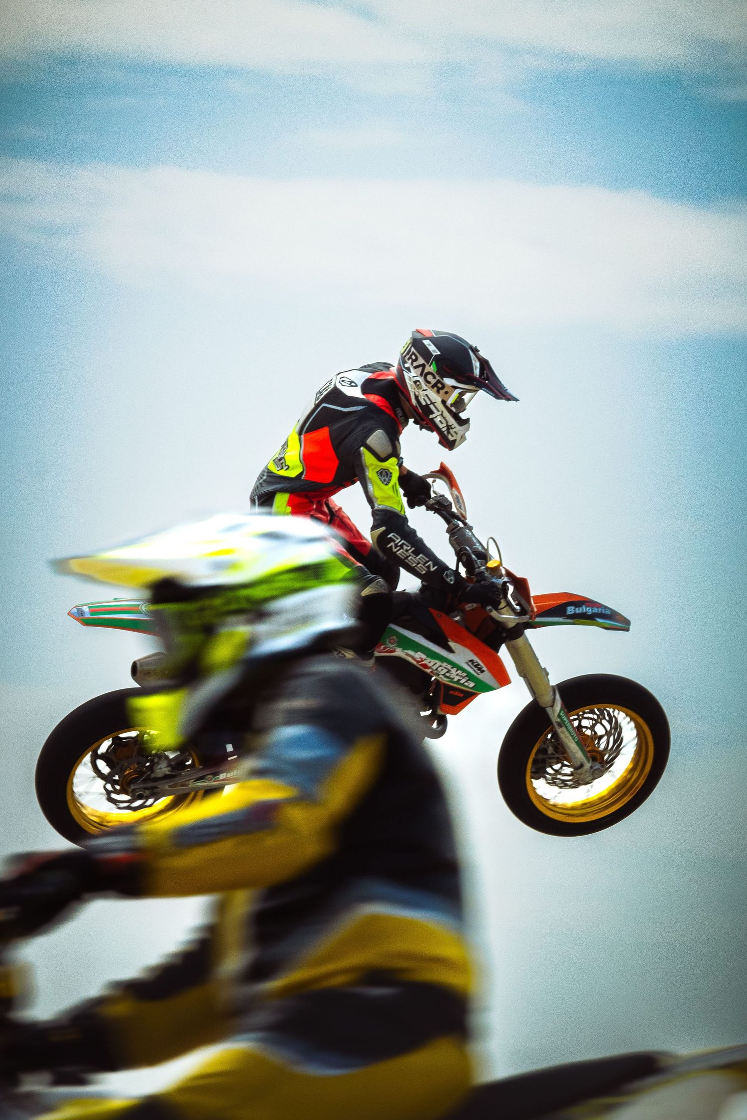 Motocross rider performing jump during race event – sports photography in Bulgaria.