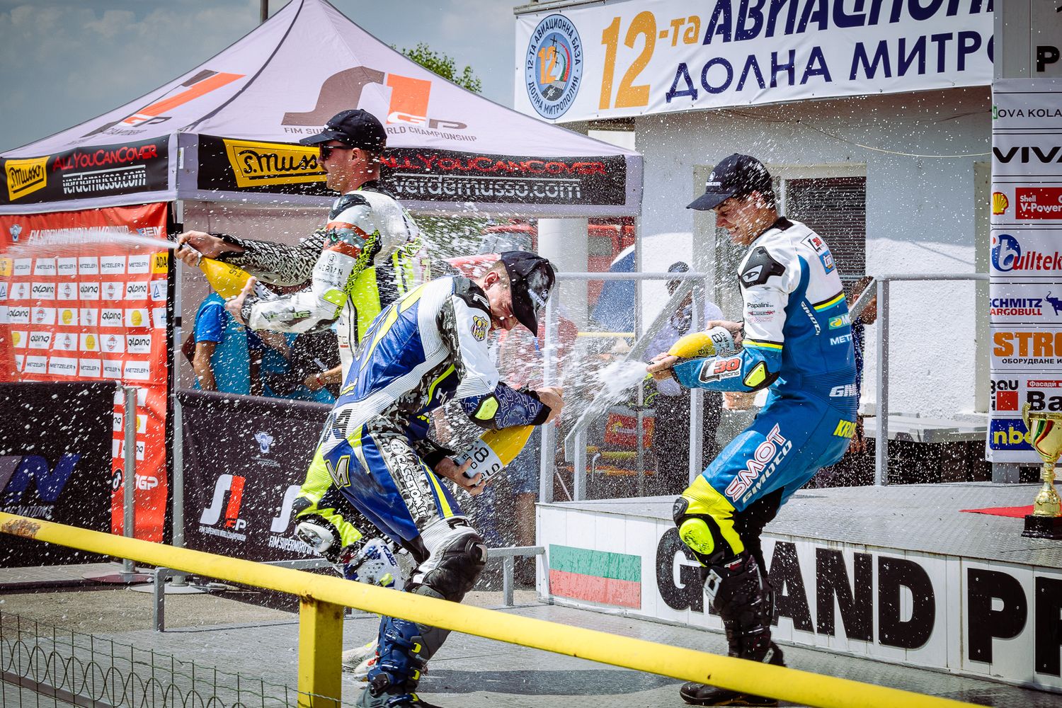 Official podium ceremony at a FIM racing event in Bulgaria, documenting award presentation and sporting achievement.