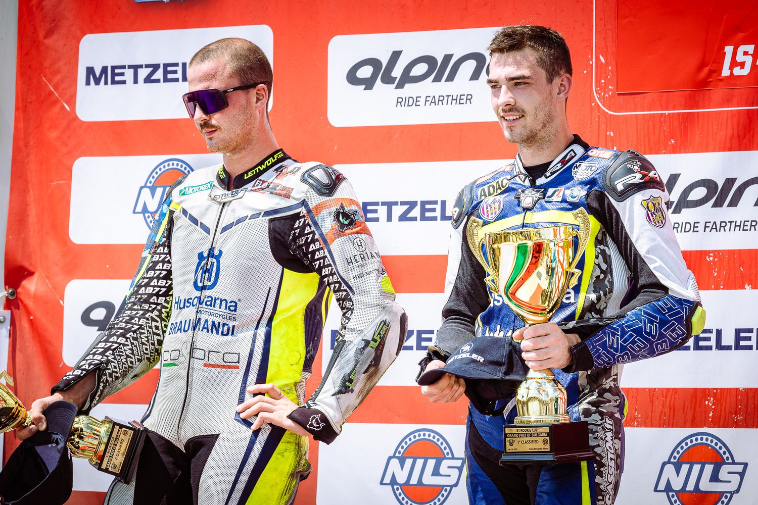 Podium champagne celebration during a FIM motorsport championship in Bulgaria, capturing victory, emotion and competitive atmosphere.