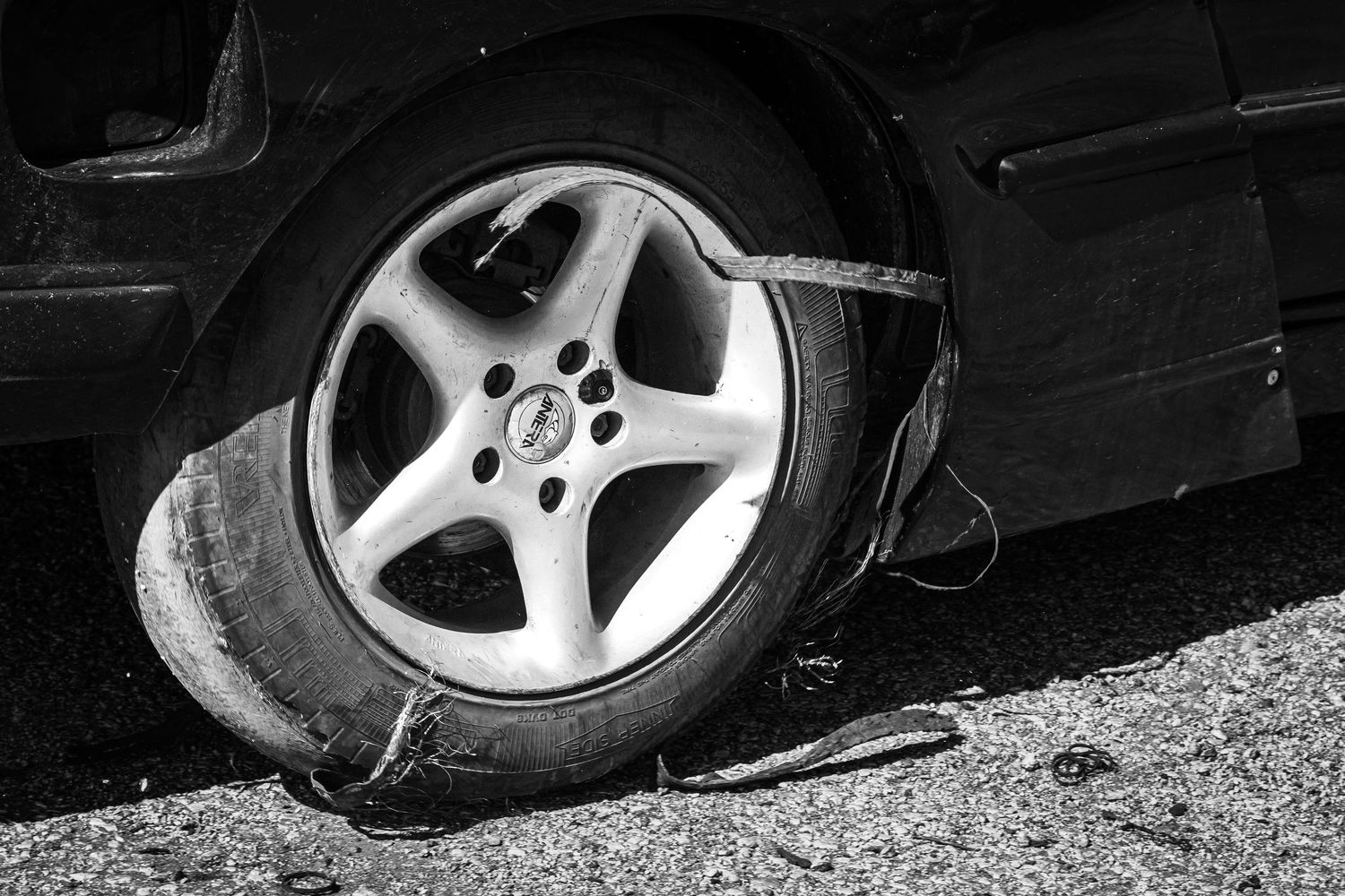Black and white detail of wear out tires due to the extreme forces and heat generated during drifting – Sport Photography in Bulgaria.