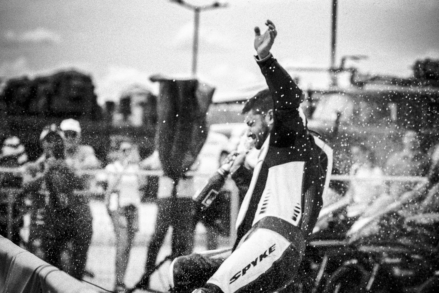 Black and white podium celebration moment, emphasizing victory, emotion and dynamic atmosphere in Bulgaria.