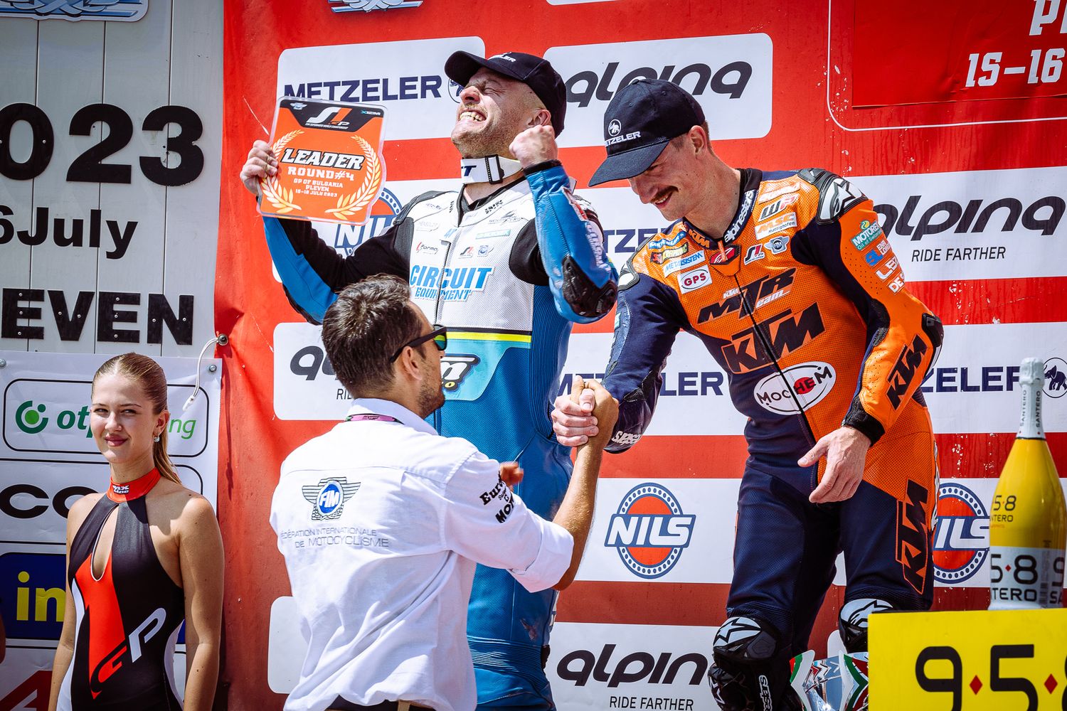 Award ceremony handshake moment on podium stage, documenting recognition and sportsmanship in Bulgaria.