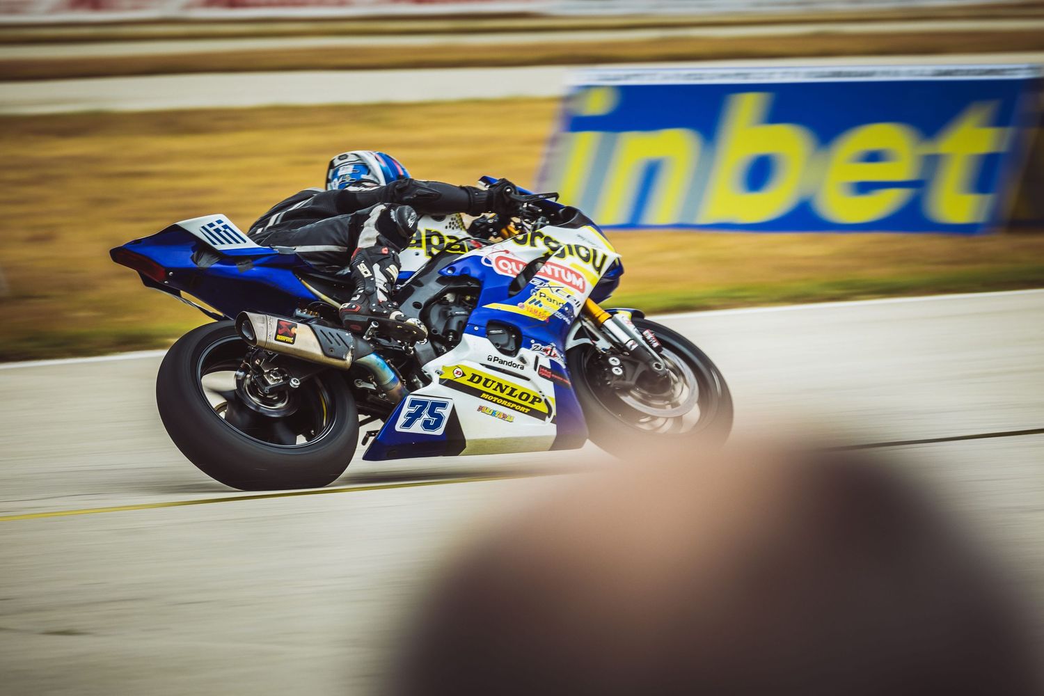 Sportbike rider racing at high speed on track during competition – motorsport photography in Bulgaria.