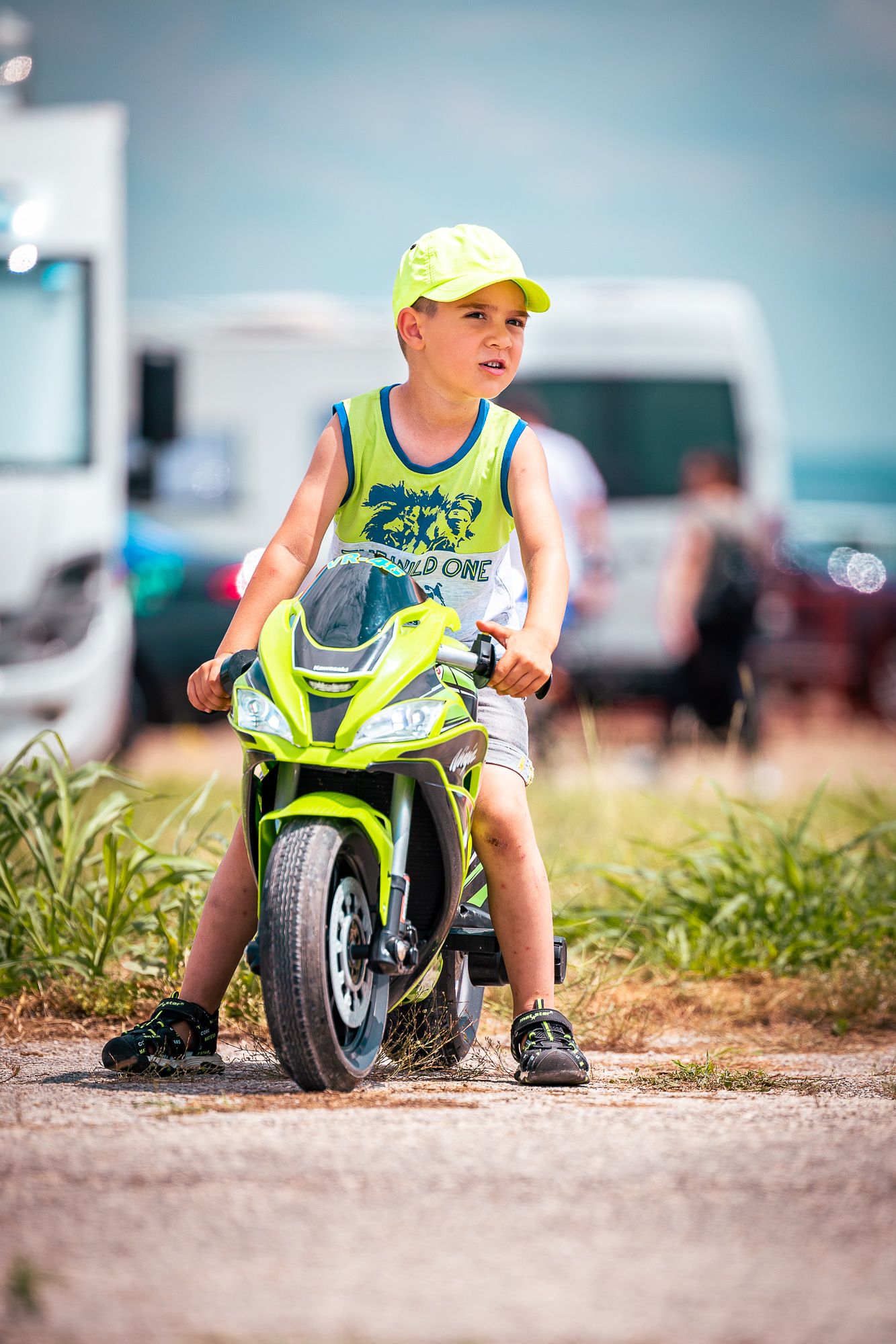 Young participant with mini racing bike, highlighting grassroots passion and the next generation of motorsport in Bulgaria.