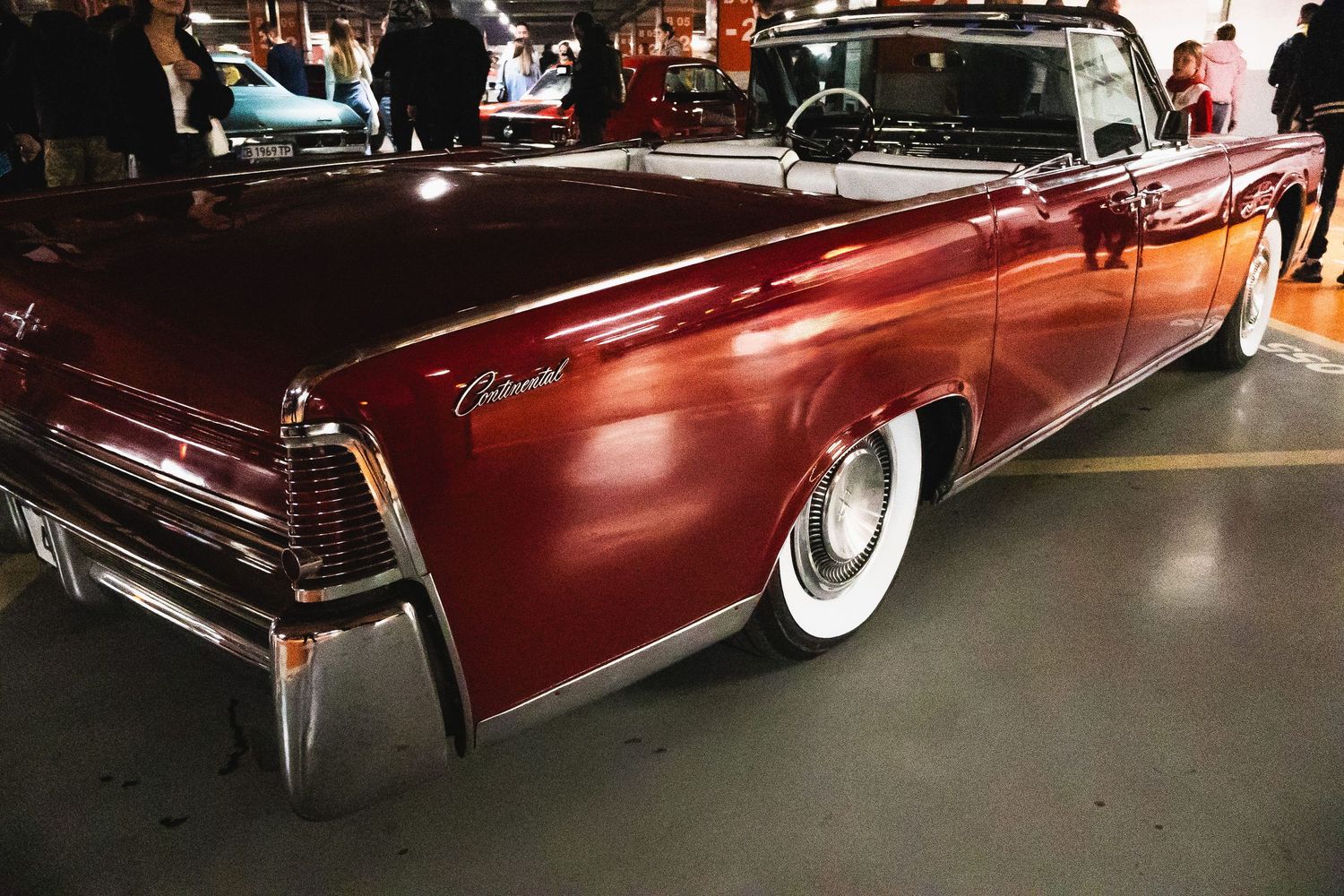 Classic red American convertible with whitewall tires at car show – automotive photography in Bulgaria.