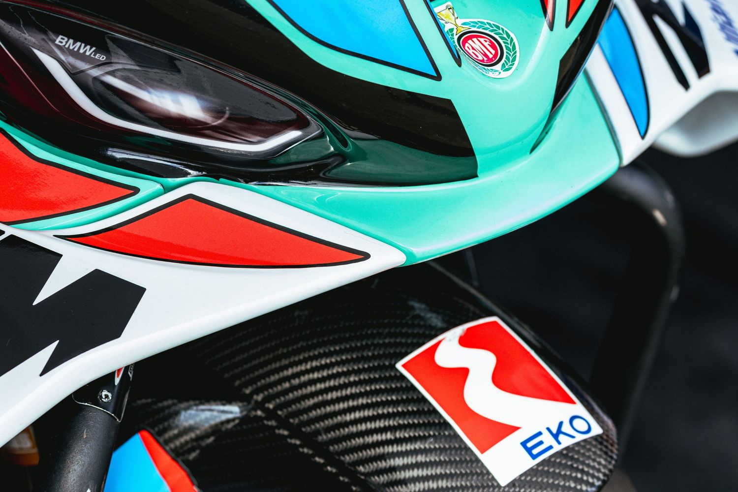 Detail of racing motorcycle fairing and headlight before competition – motorsport photography in Bulgaria.