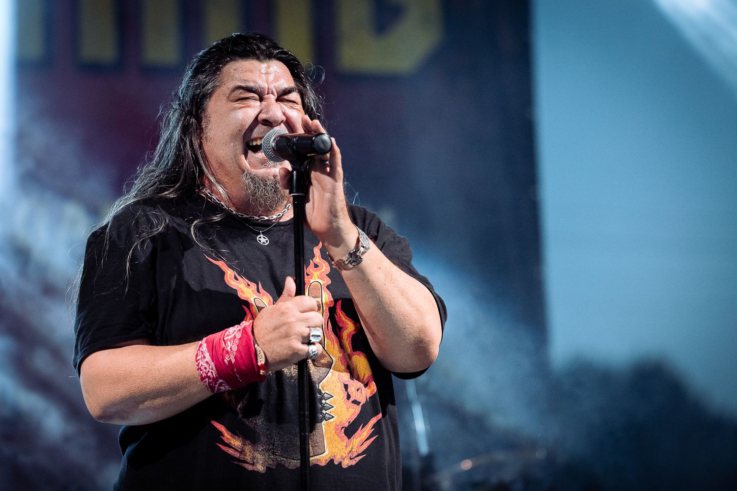 Live concert performance captured mid-emotion, with powerful stage presence and dramatic lighting in Bulgaria.
