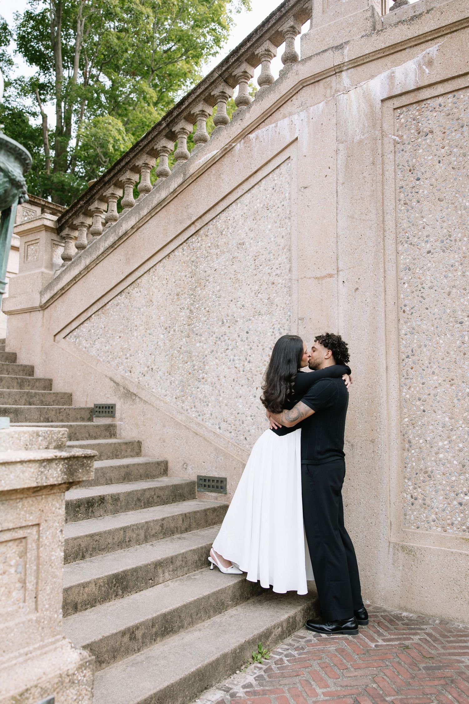 A sequence showing movement along stone steps against a textured wall with classical architectural details.