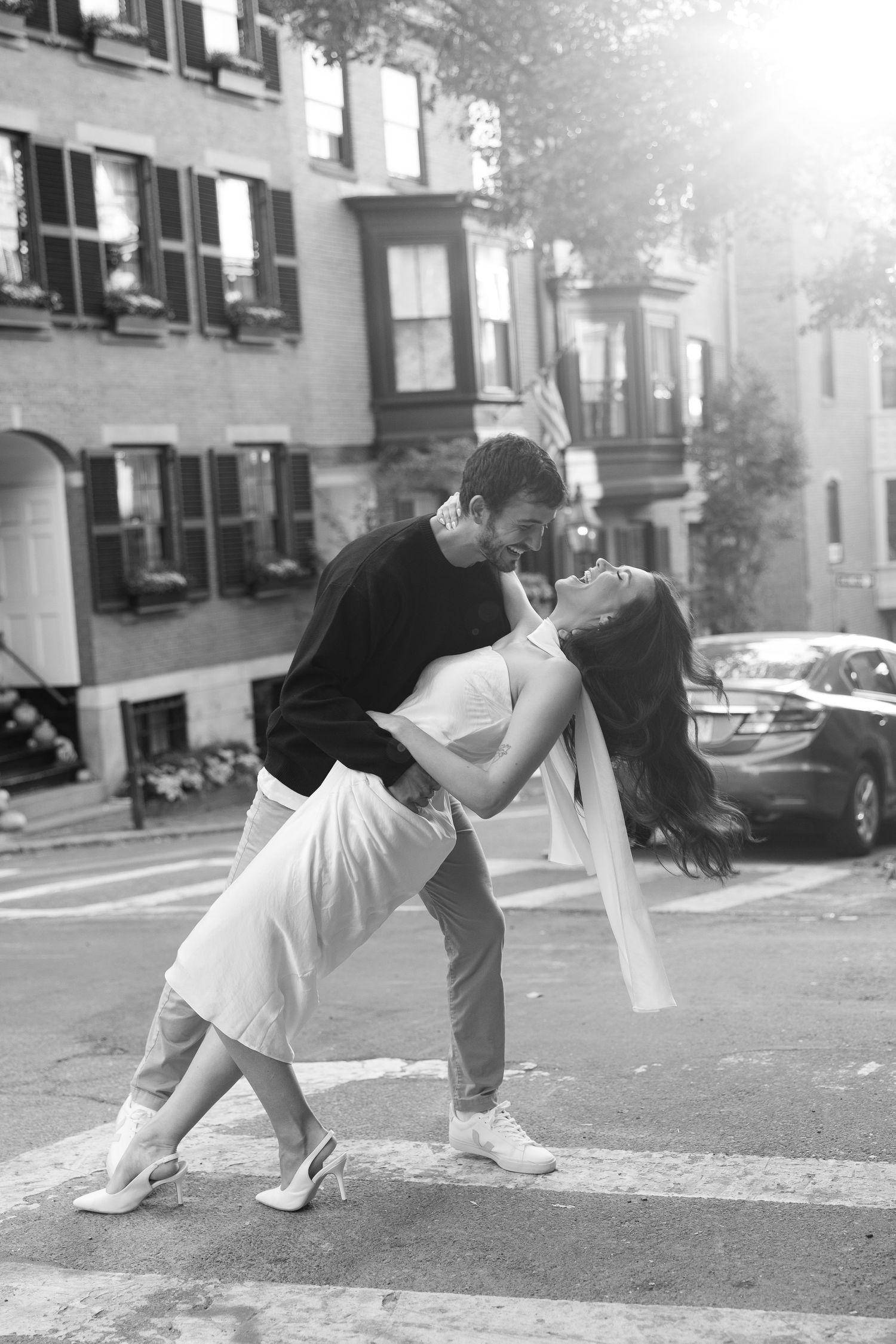 Black and white photo series of a dance sequence on a city street.