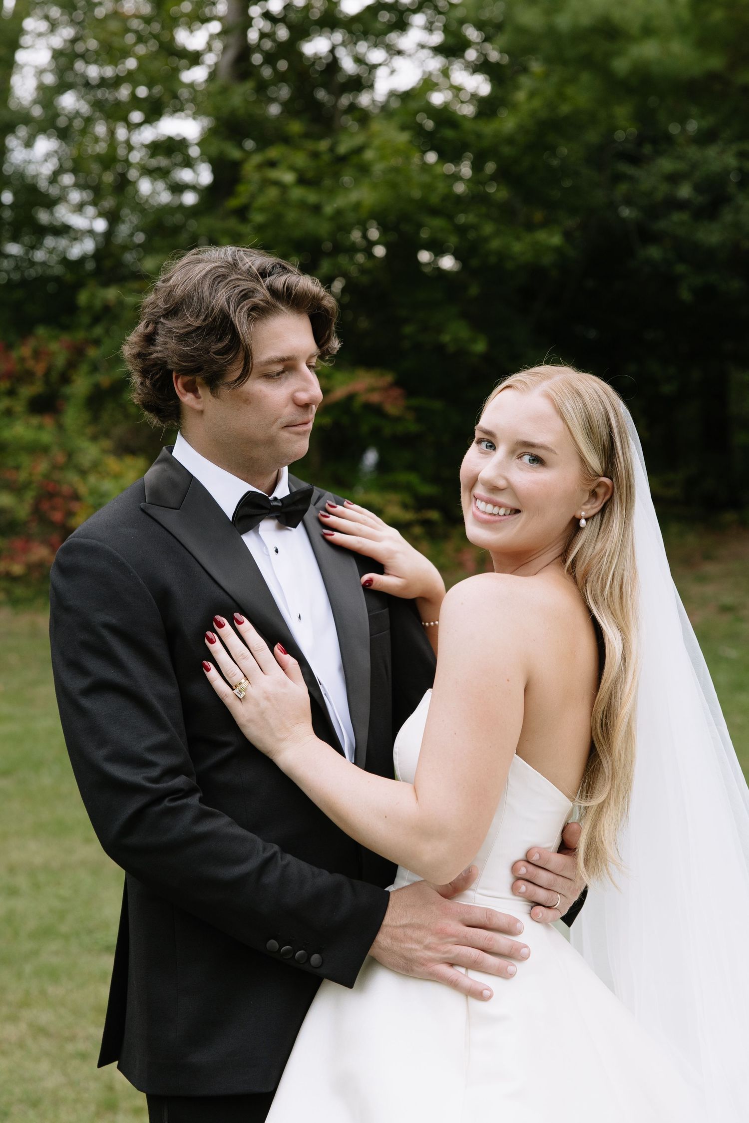 Candid wedding couple portraits showing intimate moments and laughter.