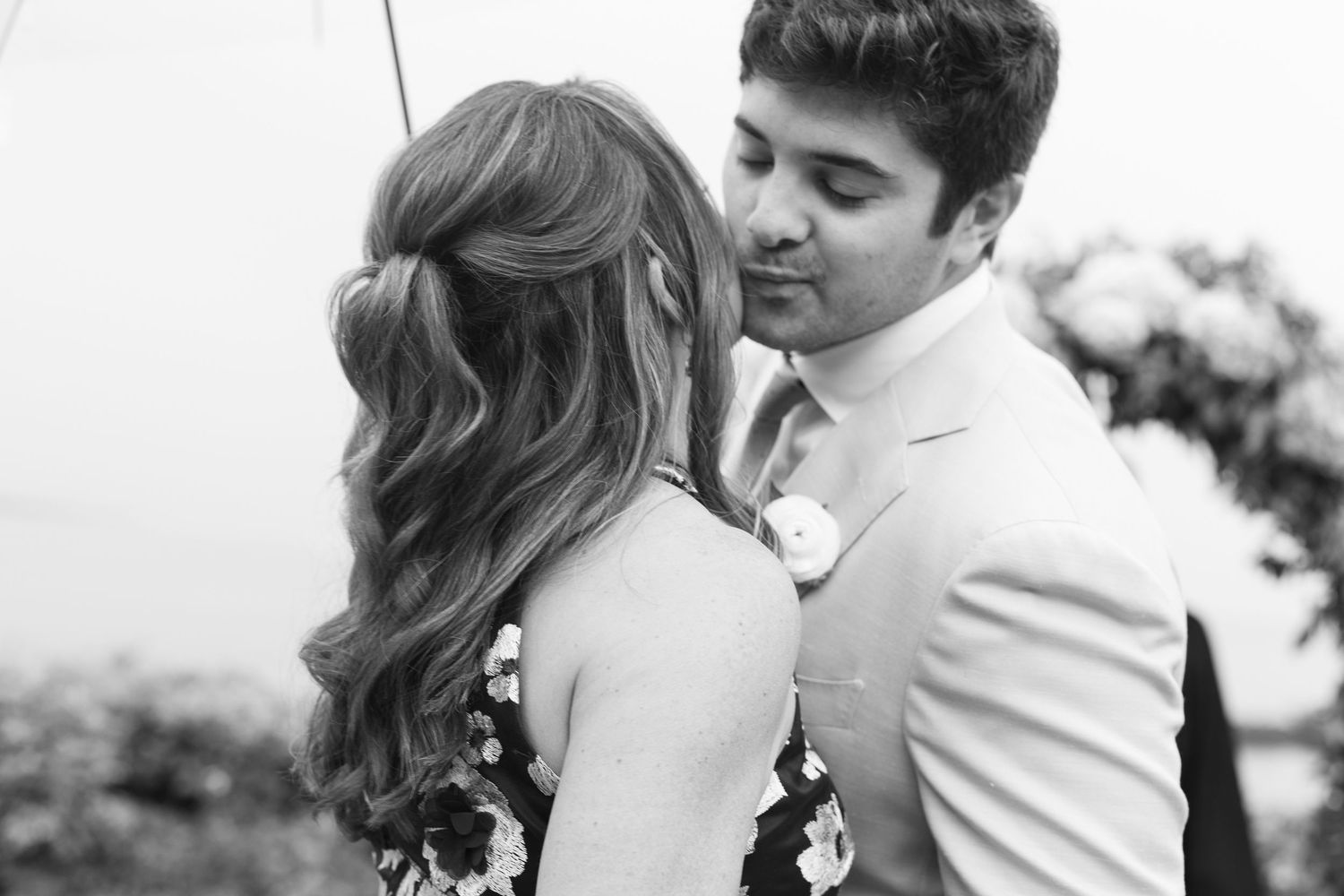 A romantic black and white wedding portrait sequence showing tender moments between newlyweds.