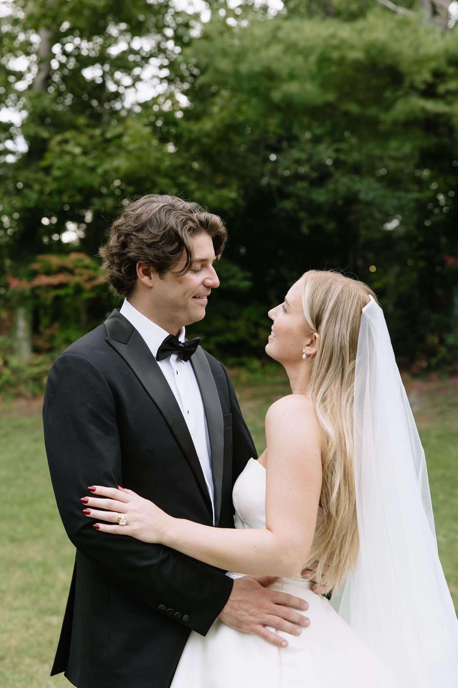 A romantic series of wedding couple portraits taken outdoors in a natural setting.
