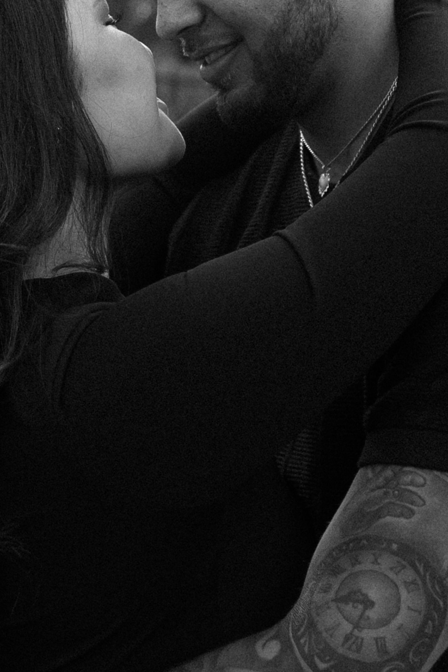 Intimate black and white close-up shots showing affectionate moments.