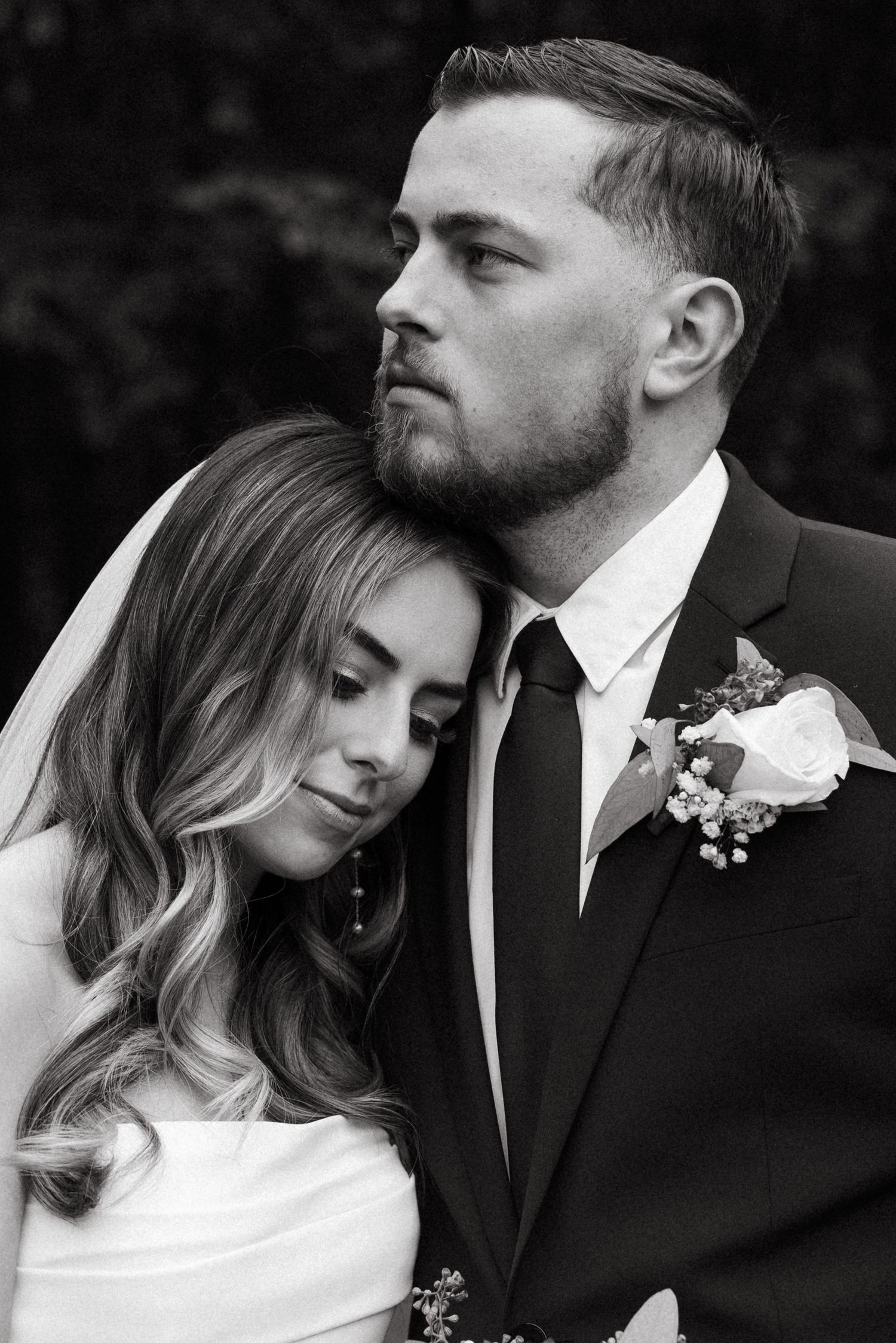 Intimate black and white portrait series of newlywed couple.