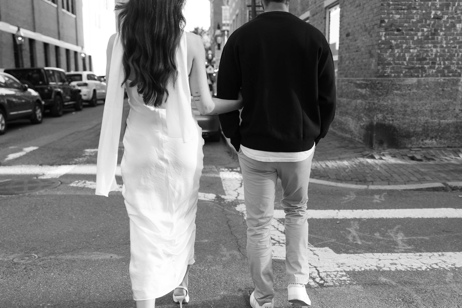 Urban photo series of two people walking down a city street.