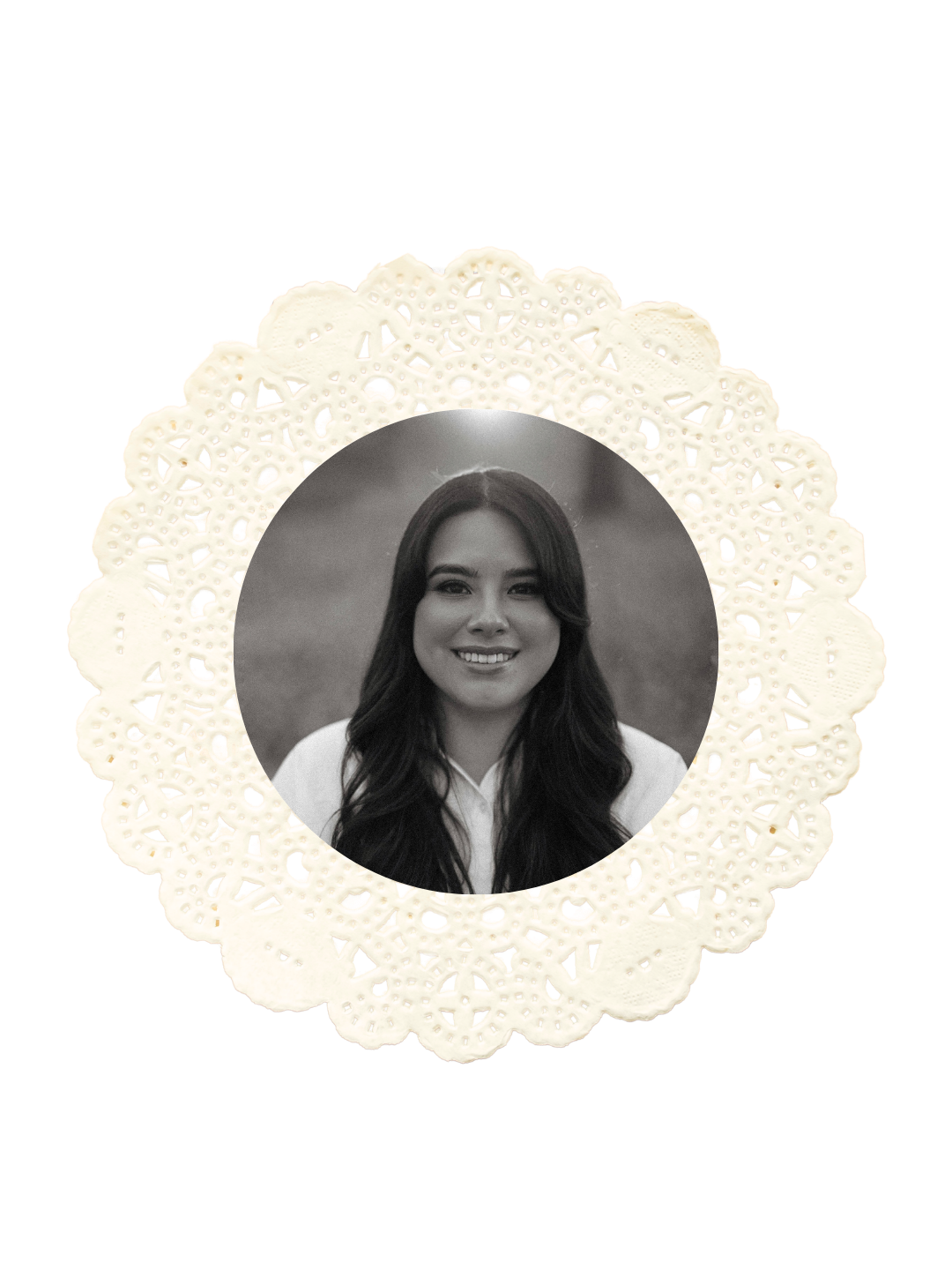 Black and white portrait photo framed in a decorative cream lace doily of a young woman with long dark hair smiling.
