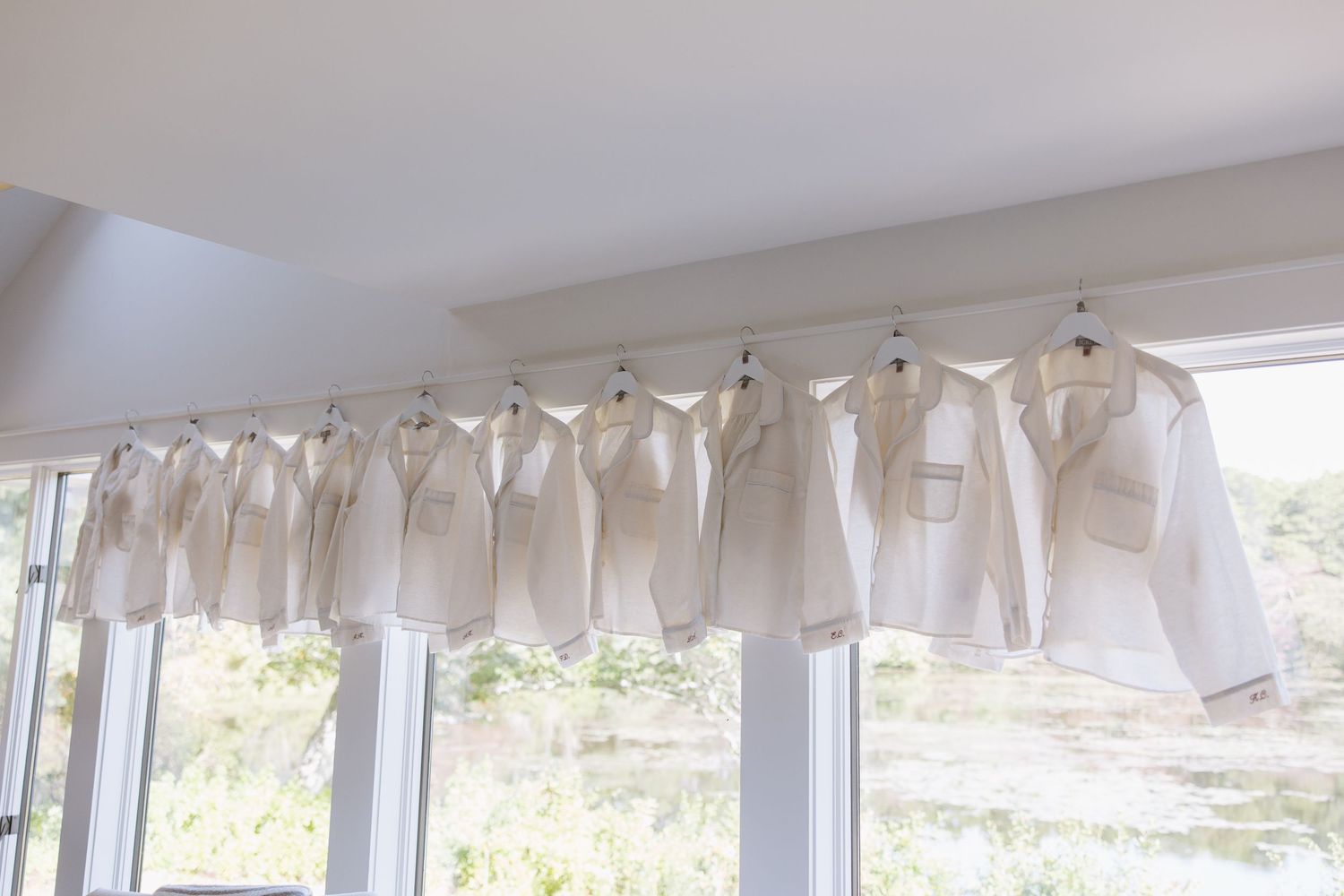 White fabric decorations hanging from ceiling create an elegant wedding reception atmosphere.