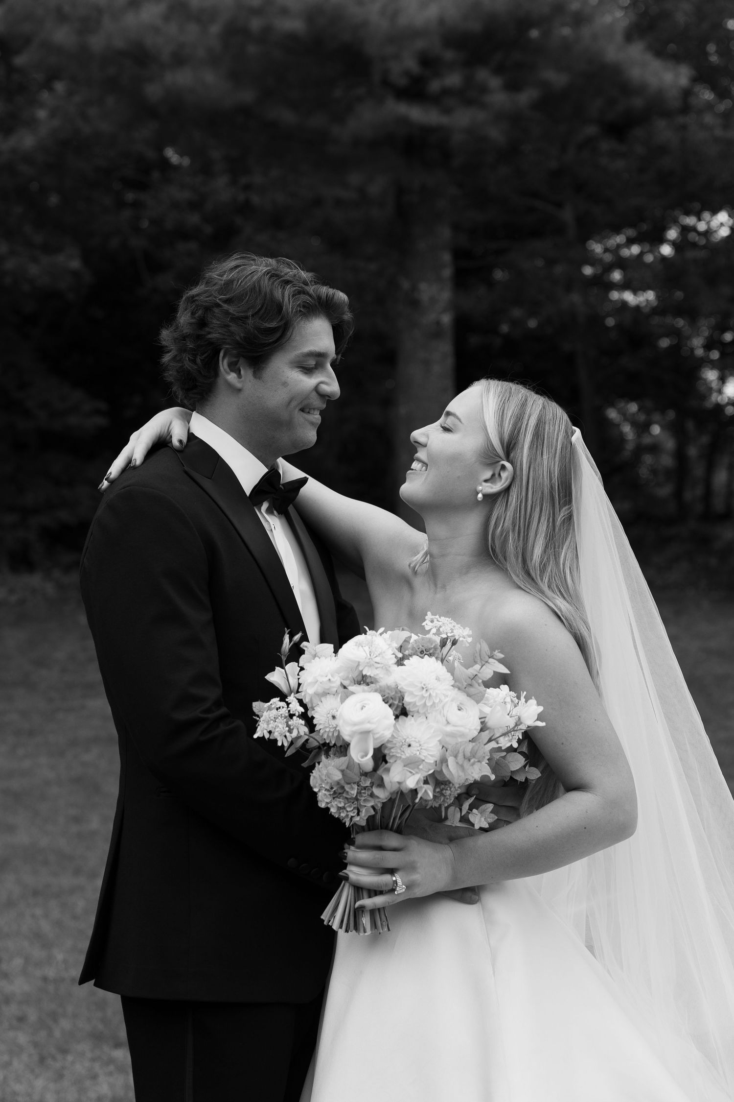 Romantic black and white wedding portraits showing tender moments between the newlyweds.