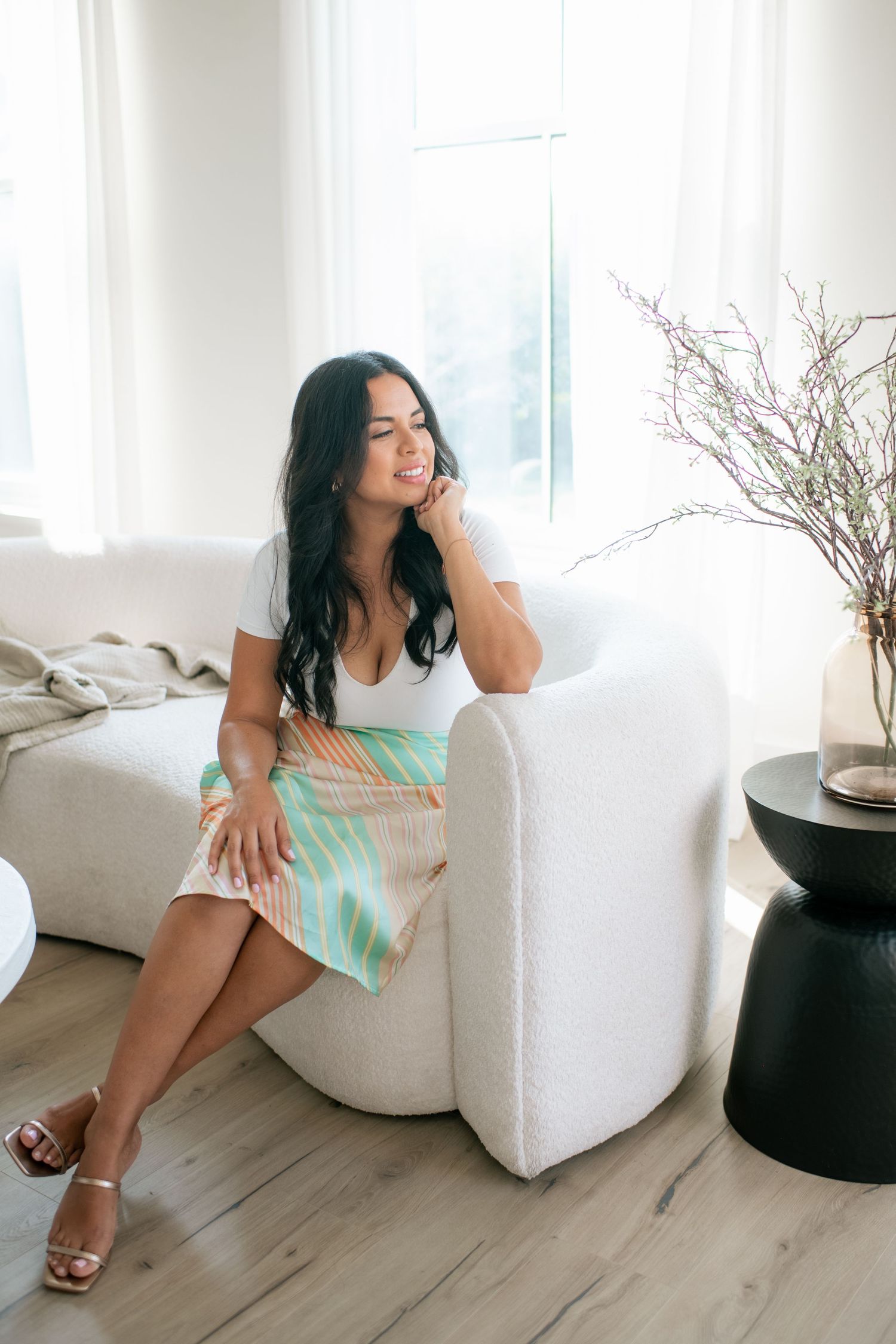 Lifestyle photography session with mint dress and white modern furniture.