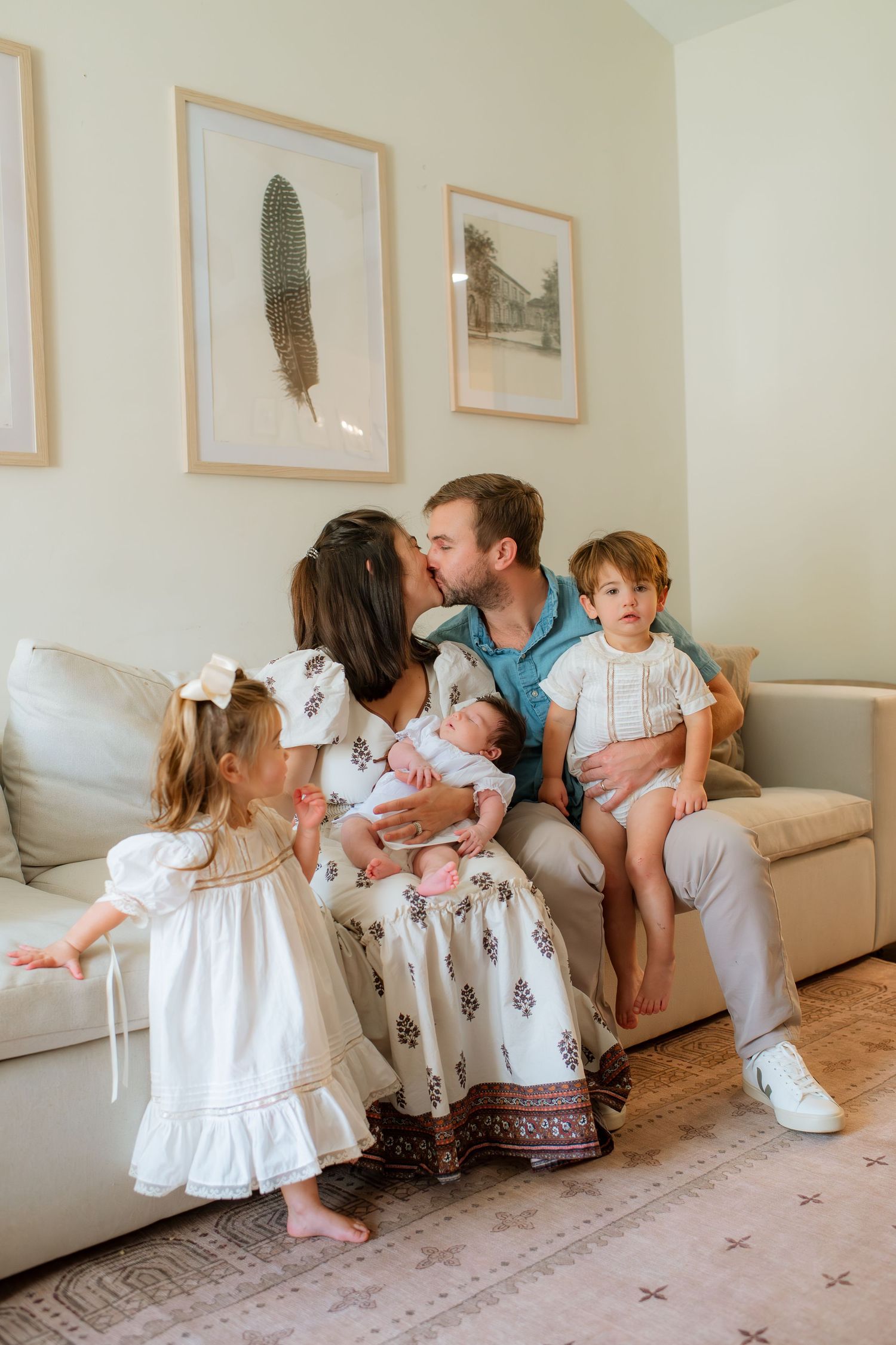 A series of candid family photos showing playful moments and embraces in a cozy living room setting.