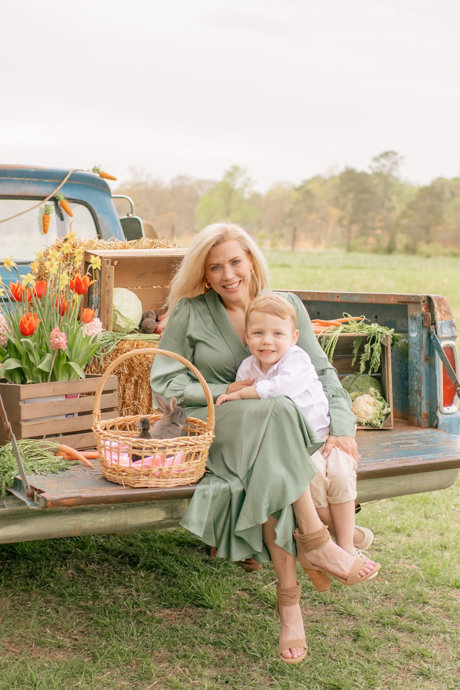 A spring photo session in the back of a vintage truck decorated with tulips, baskets and seasonal decor.