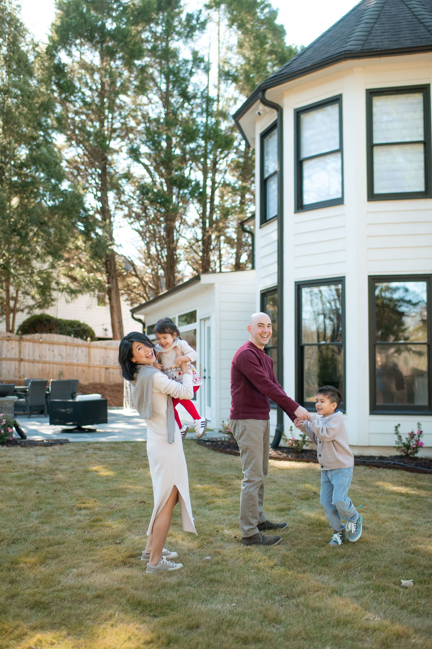 A sequence of photos showing people playing catch with a football in a backyard with a white house in the background.