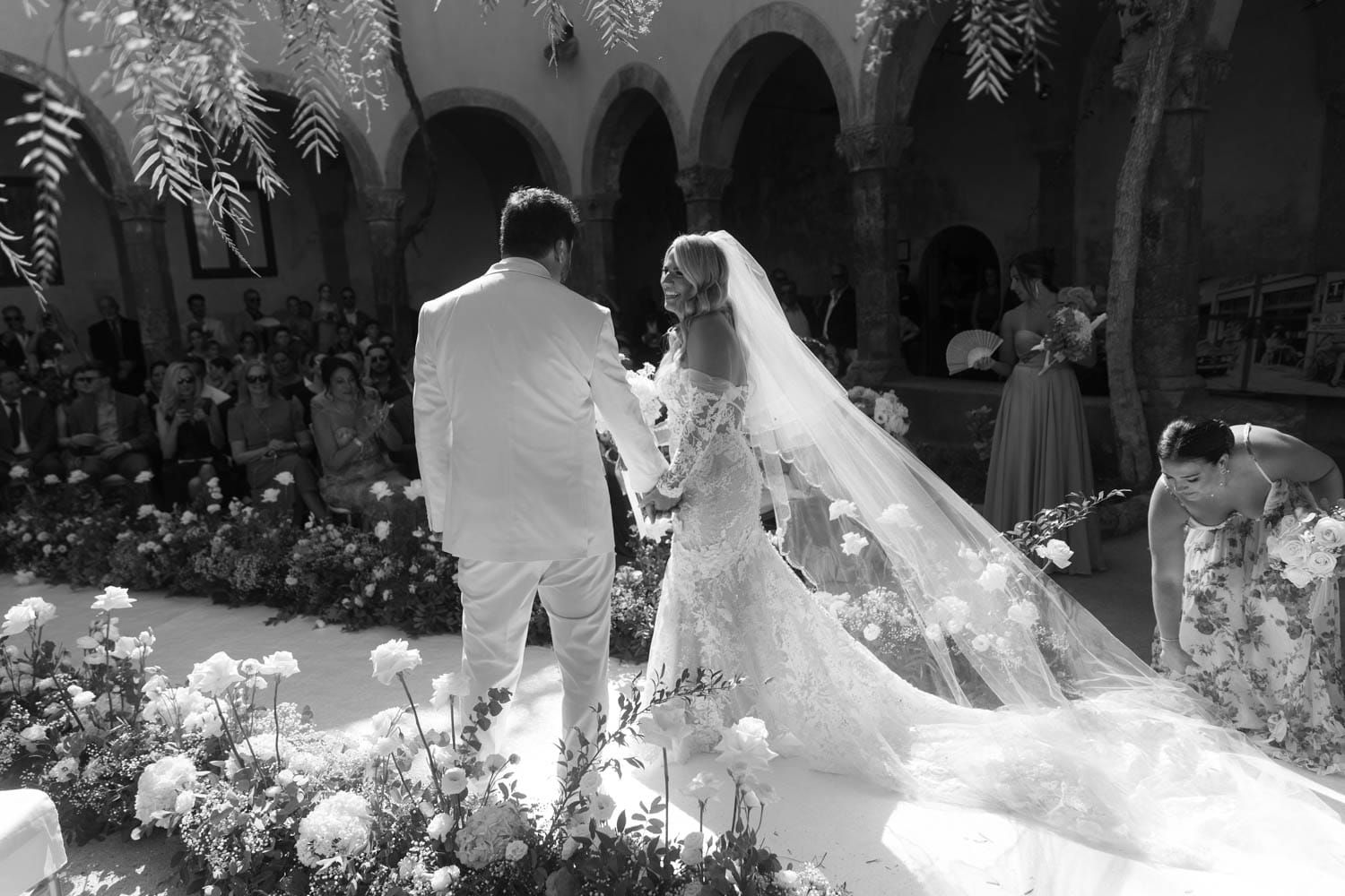 A black and white infrared photograph shows a tranquil garden scene with glowing white foliage and dark shadows. Grand Hotel Royal Sorrento