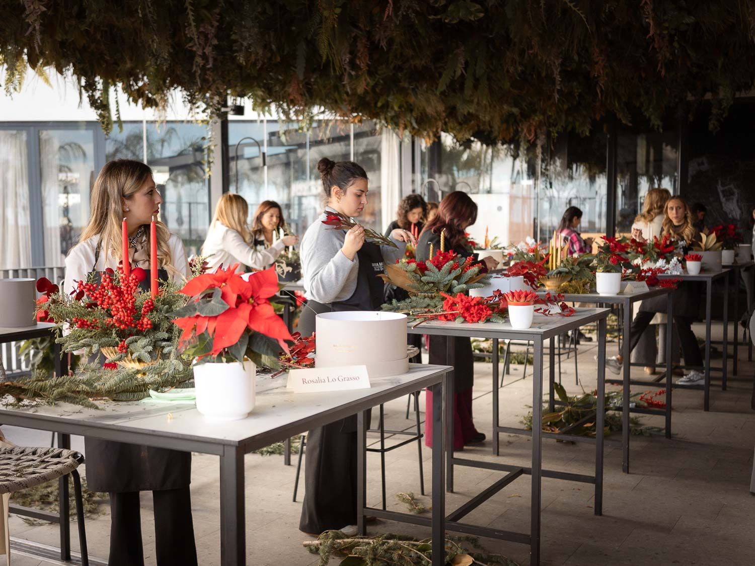 Workshop space with multiple tables set up for floral design instruction and demonstrations.