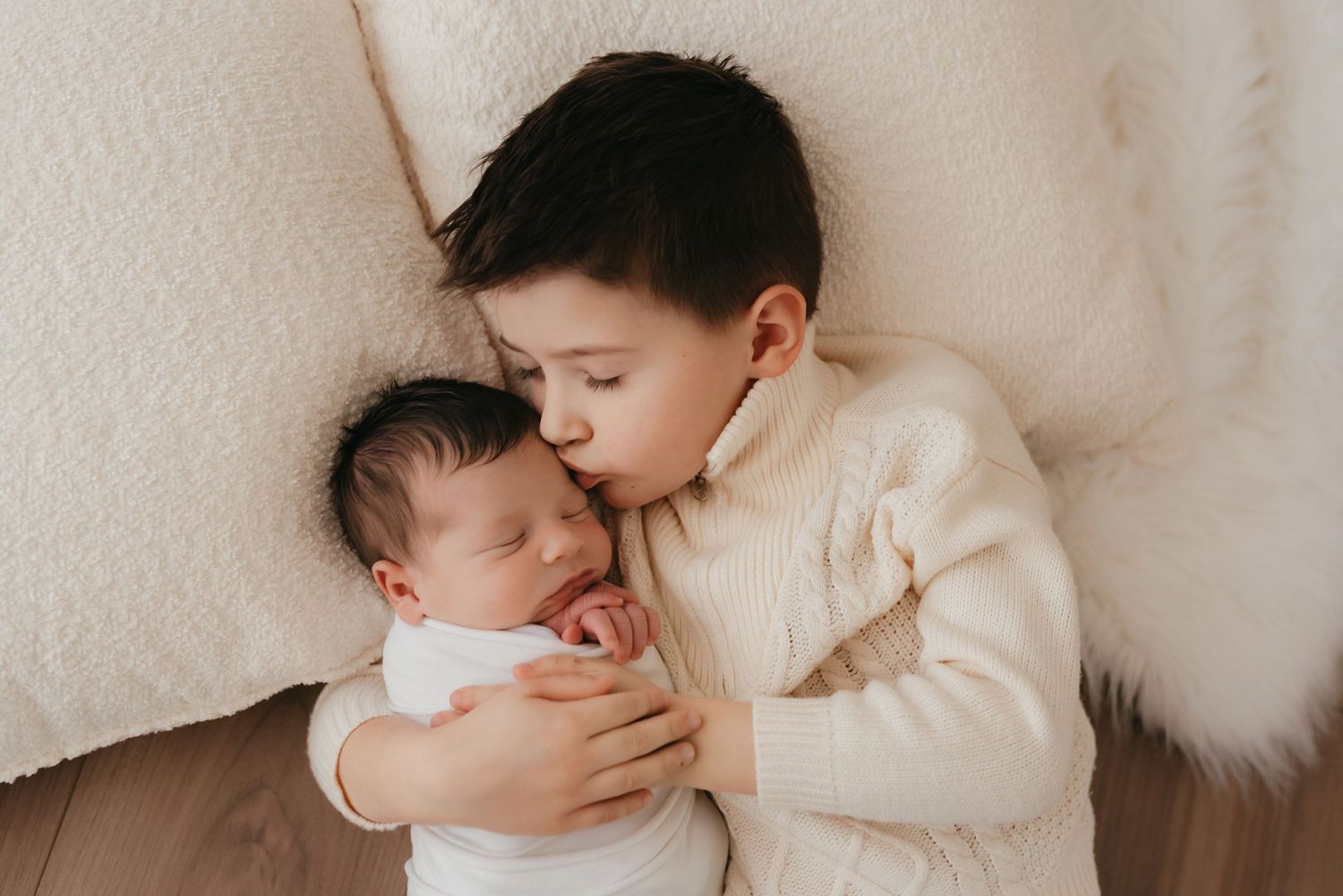 Newborn posed in studio session sibling photo
